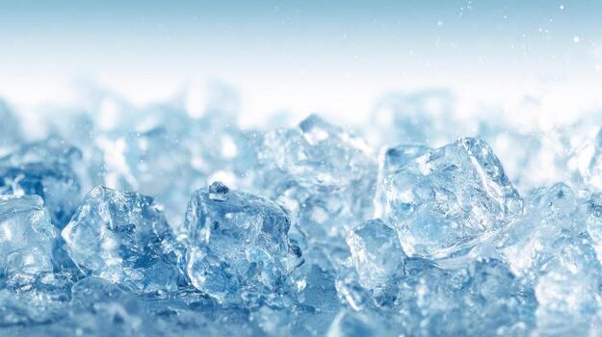 clear glass round ornament on gray stone