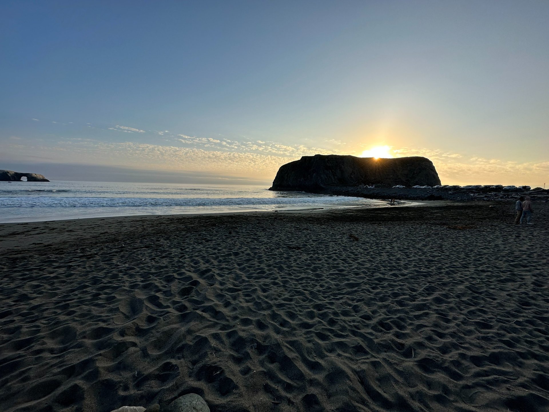 woman wearing yellow long-sleeved dress under white clouds and blue sky during daytime