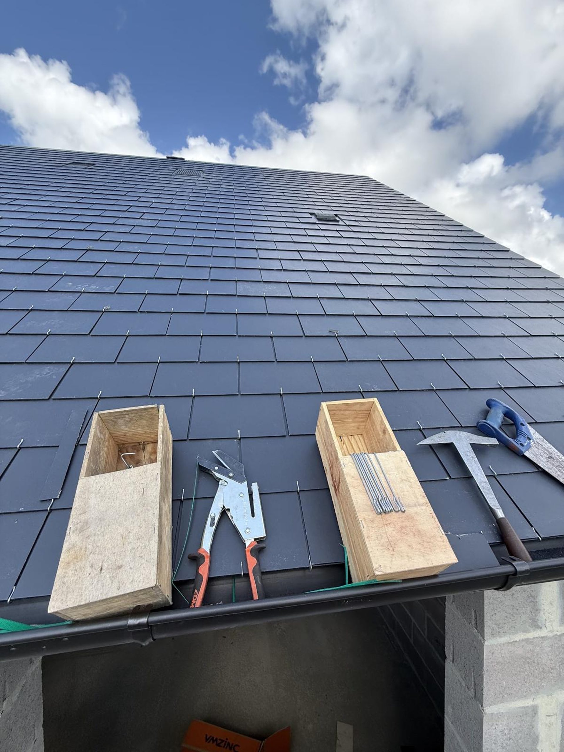 A man on a roof working on a roof
