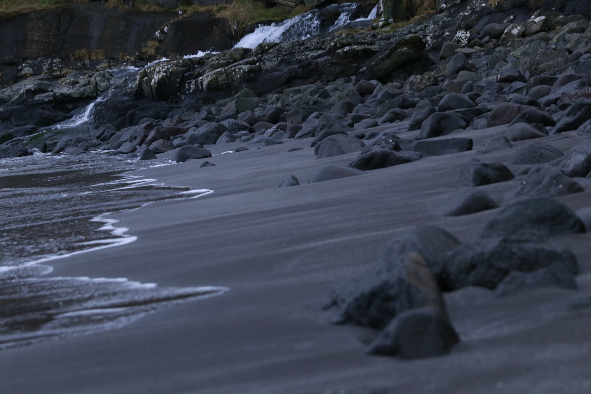 an abstract photo of a curved building with a blue sky in the background