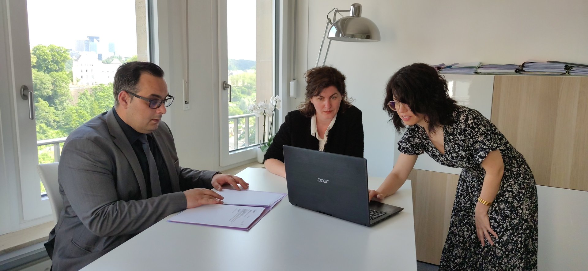 an abstract photo of a curved building with a blue sky in the background