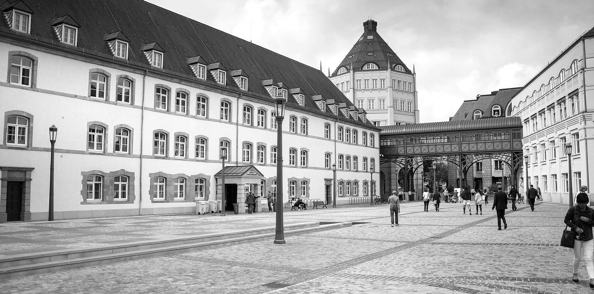 an abstract photo of a curved building with a blue sky in the background