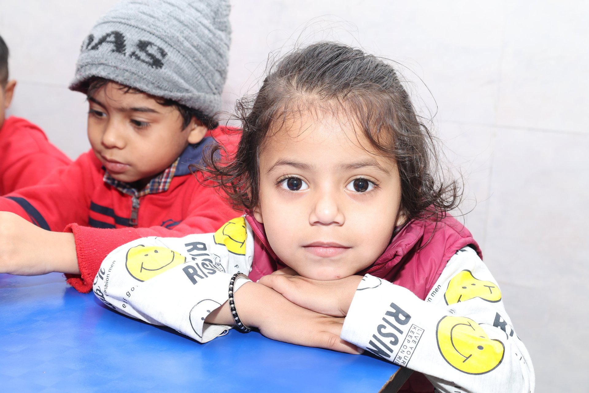 an abstract photo of a curved building with a blue sky in the background