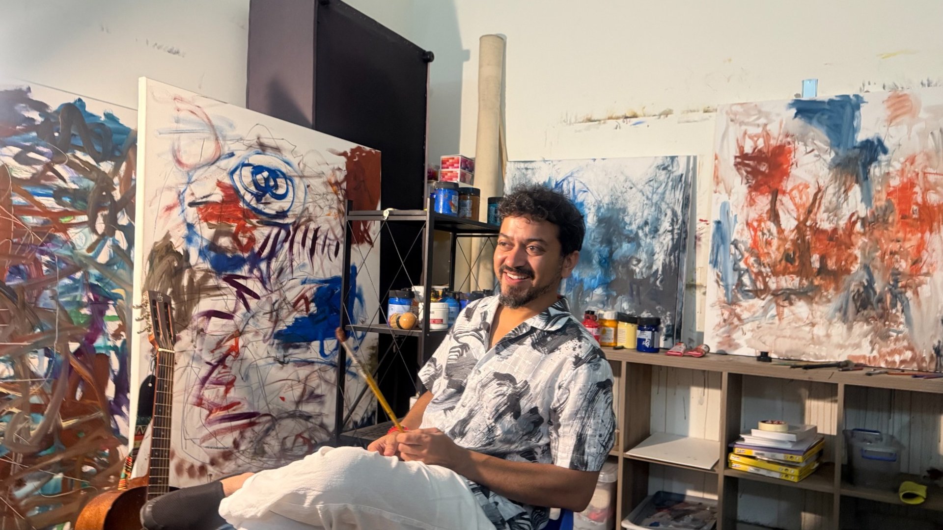 an abstract photo of a curved building with a blue sky in the background