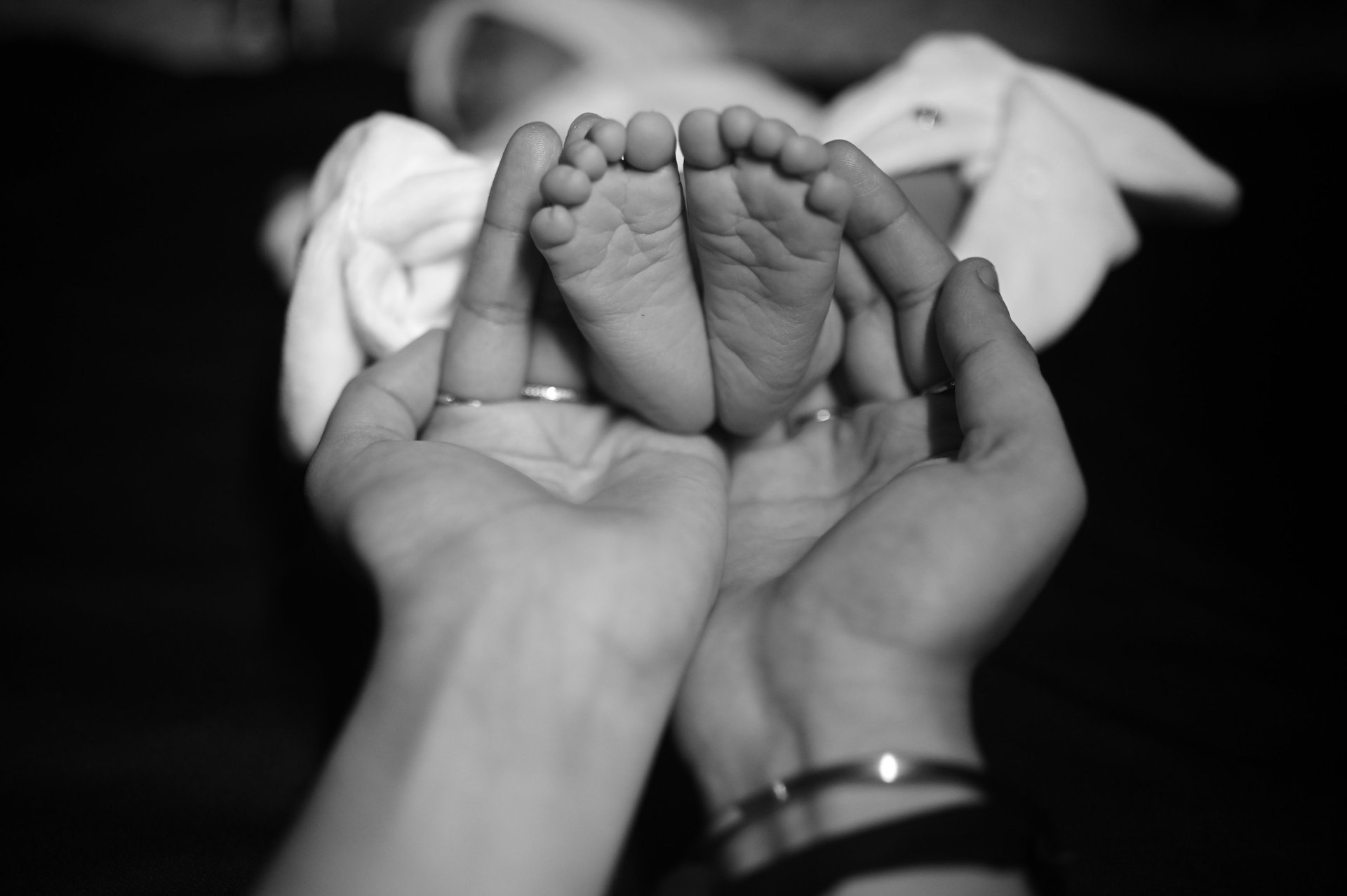 woman wearing yellow long-sleeved dress under white clouds and blue sky during daytime