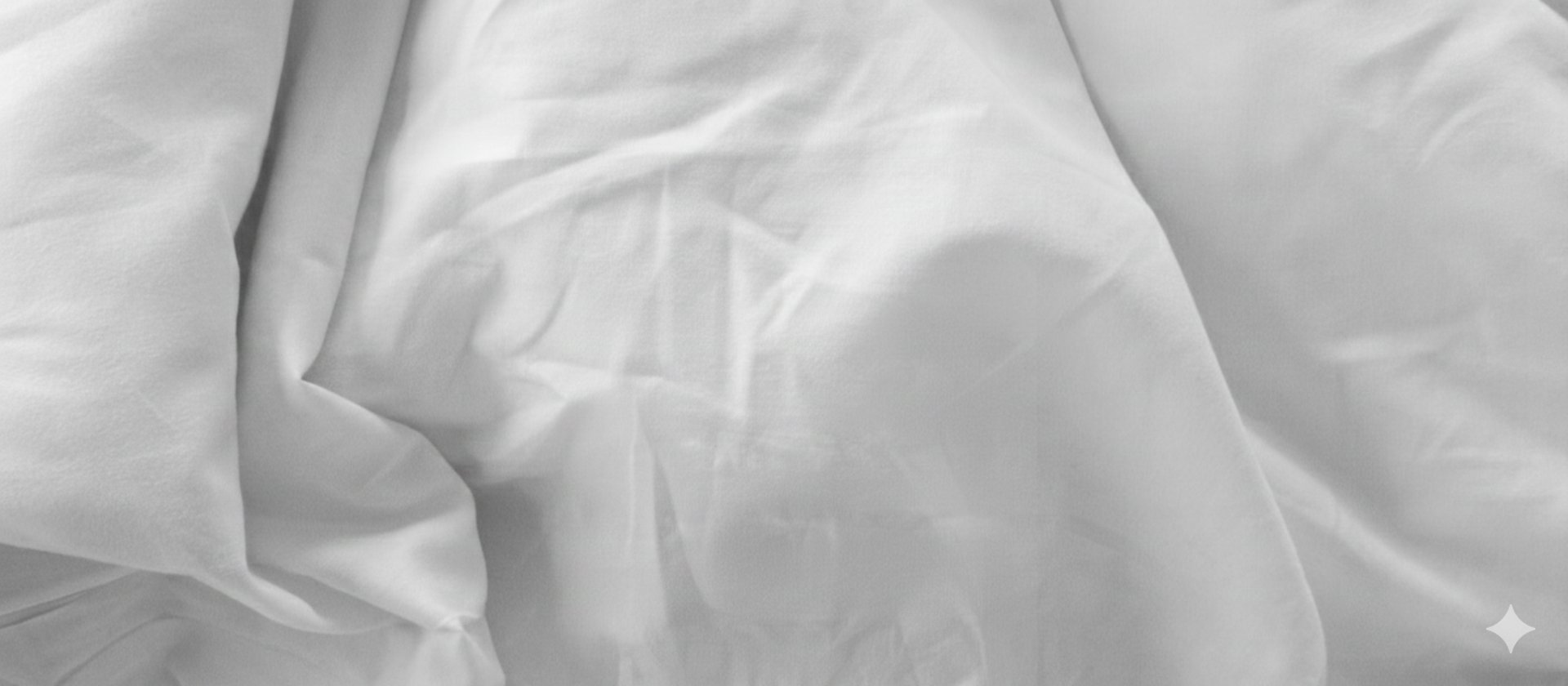 an abstract photo of a curved building with a blue sky in the background