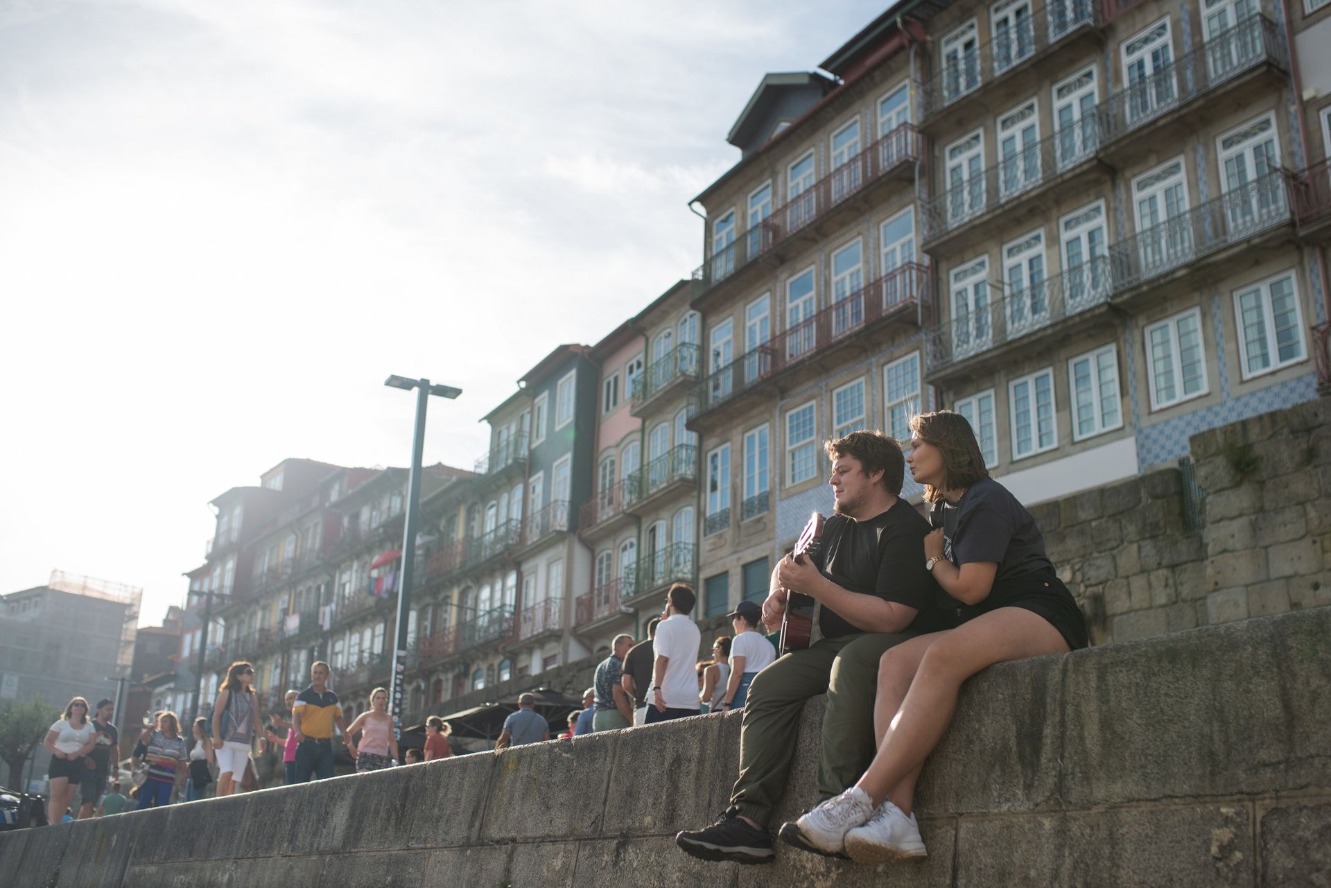 woman wearing yellow long-sleeved dress under white clouds and blue sky during daytime