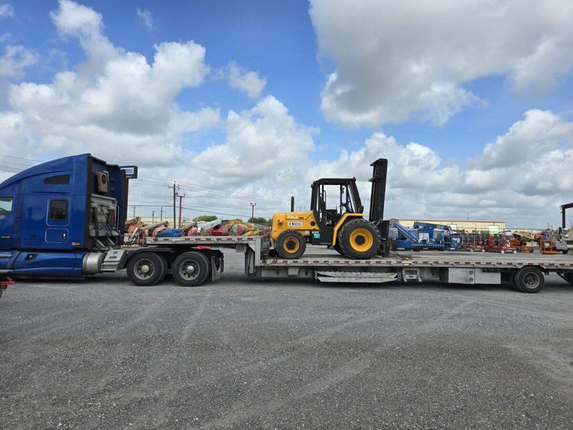 an abstract photo of a curved building with a blue sky in the background