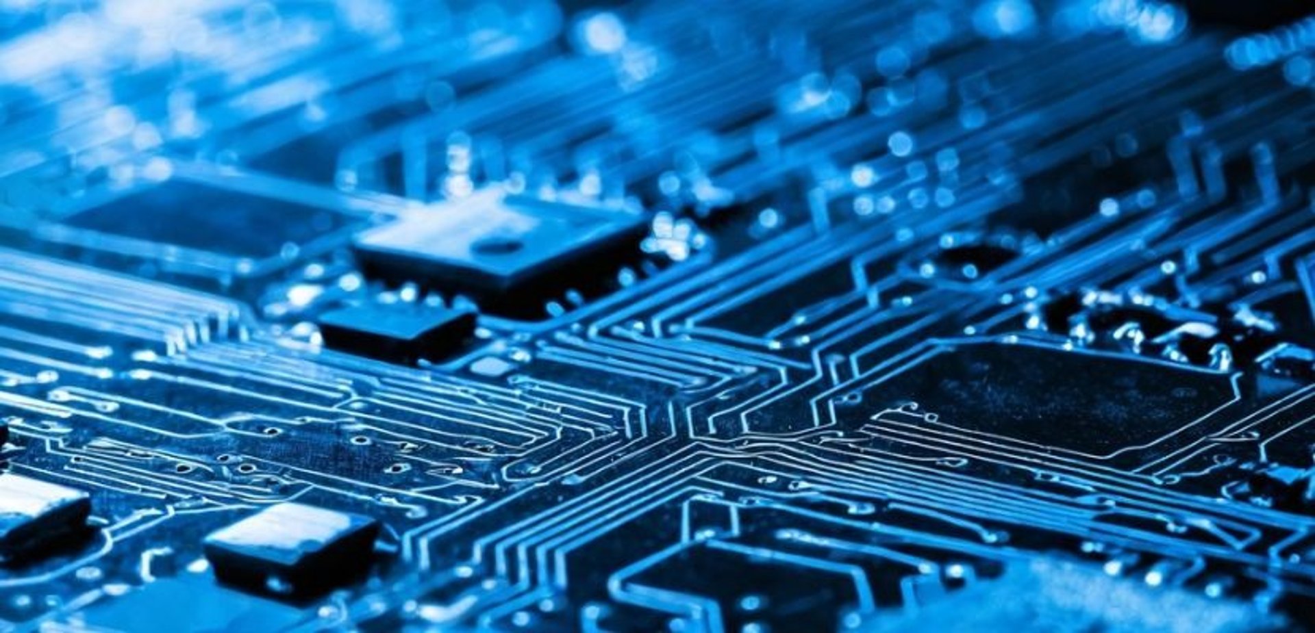 an abstract photo of a curved building with a blue sky in the background