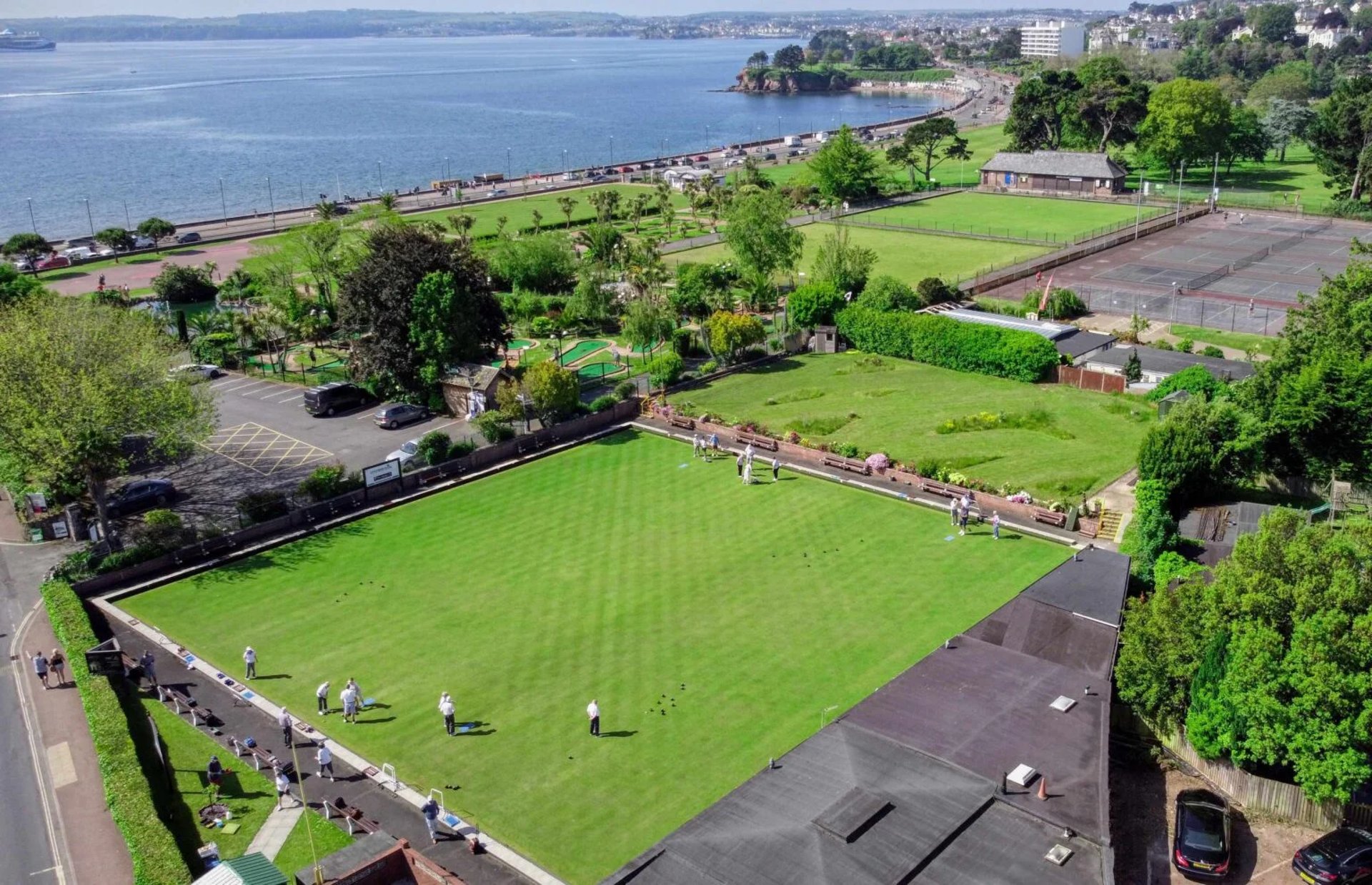 woman wearing yellow long-sleeved dress under white clouds and blue sky during daytime