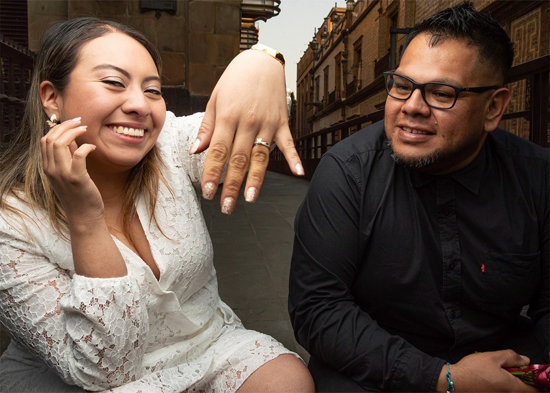 an abstract photo of a curved building with a blue sky in the background
