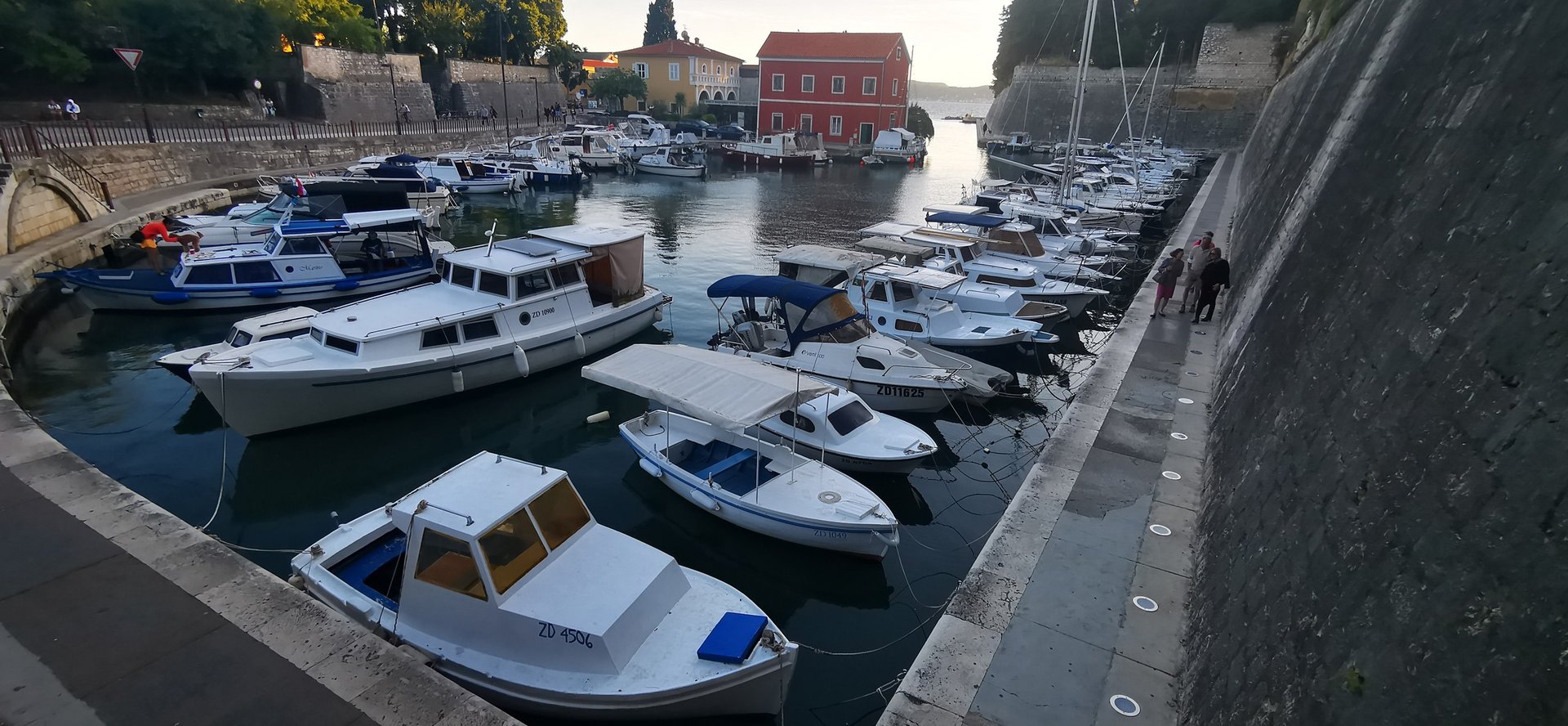 woman wearing yellow long-sleeved dress under white clouds and blue sky during daytime