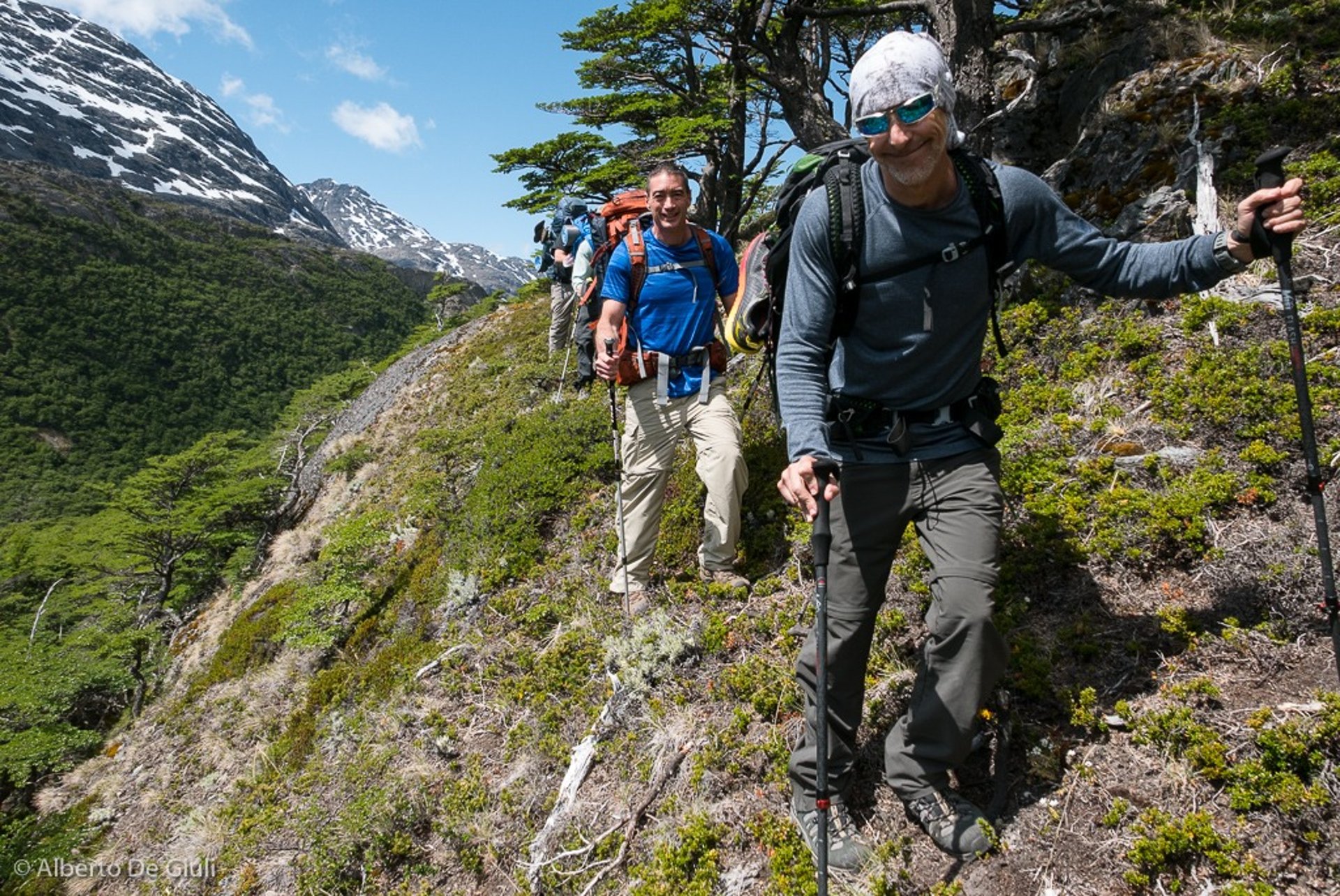 woman wearing yellow long-sleeved dress under white clouds and blue sky during daytime