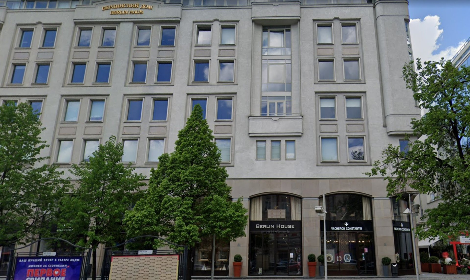 green trees in glass building