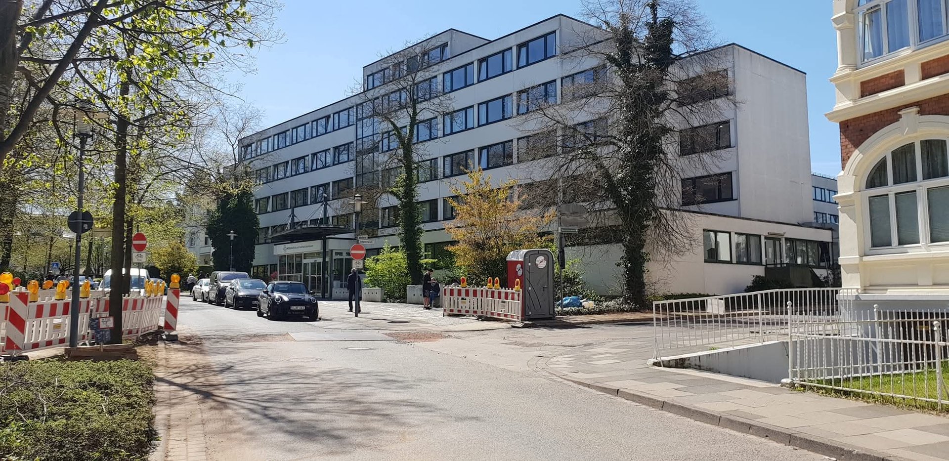 a row of wind turbines in the middle of the ocean
