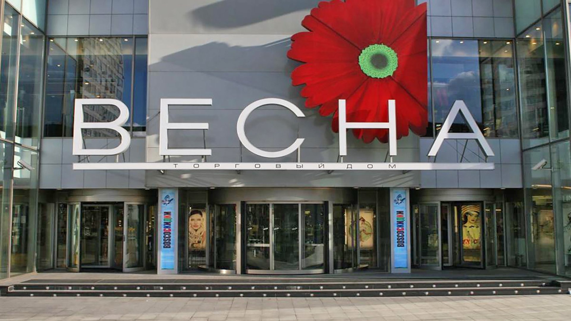 a row of wind turbines in the middle of the ocean