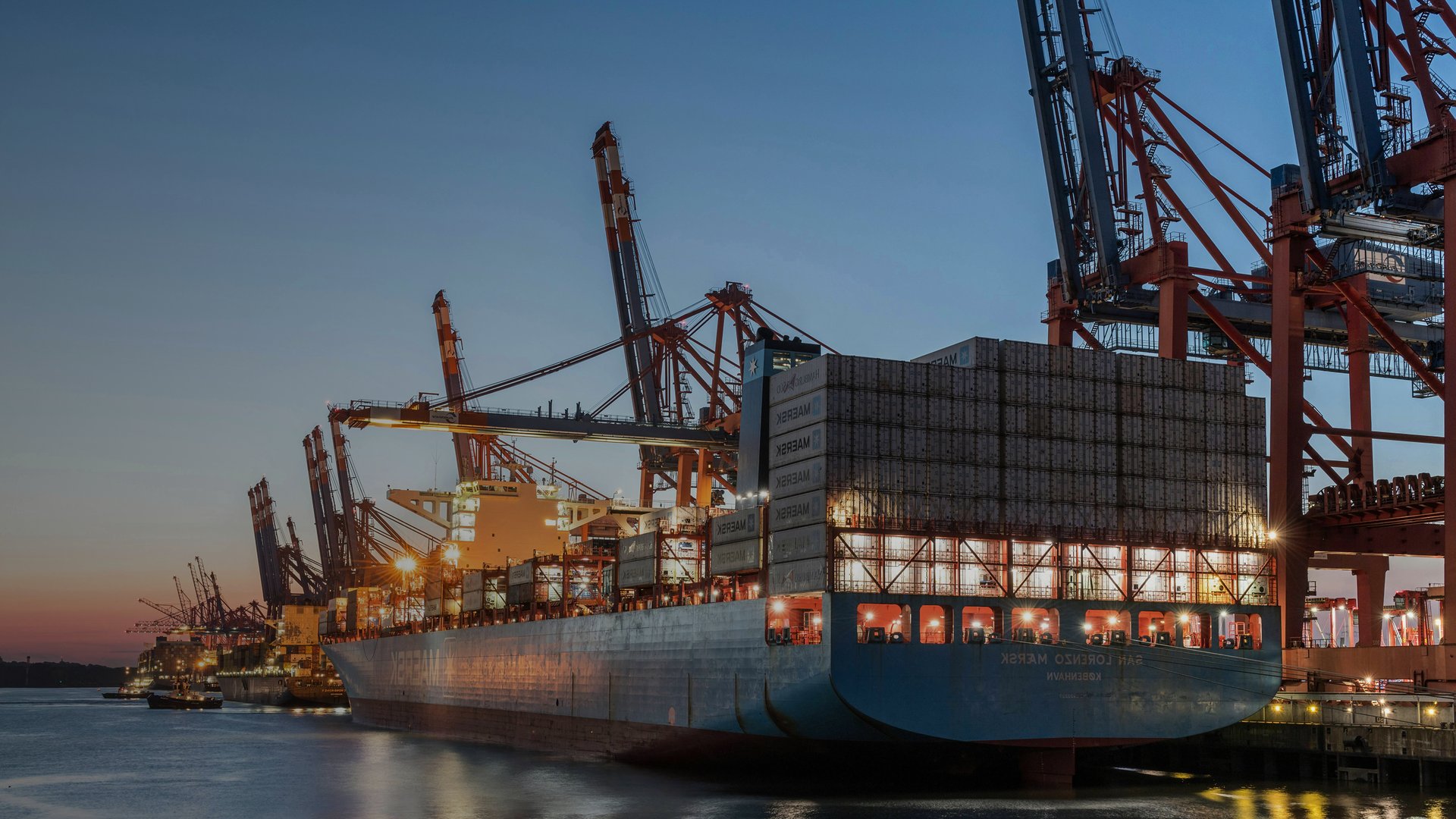 blue and red cargo ship on sea during daytime