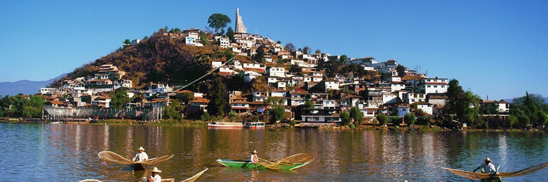 thatch hut above the sea during day