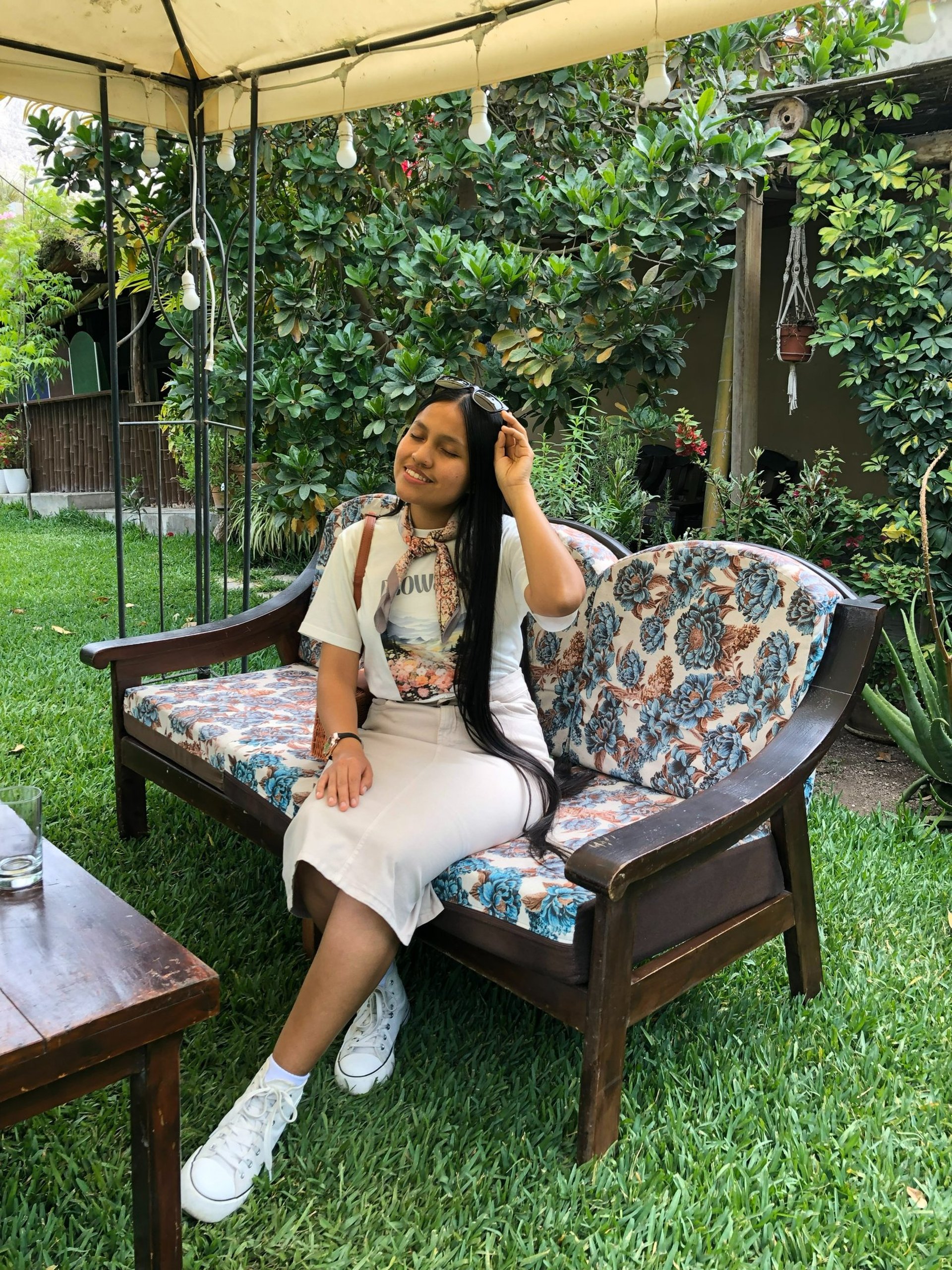 woman wearing yellow long-sleeved dress under white clouds and blue sky during daytime