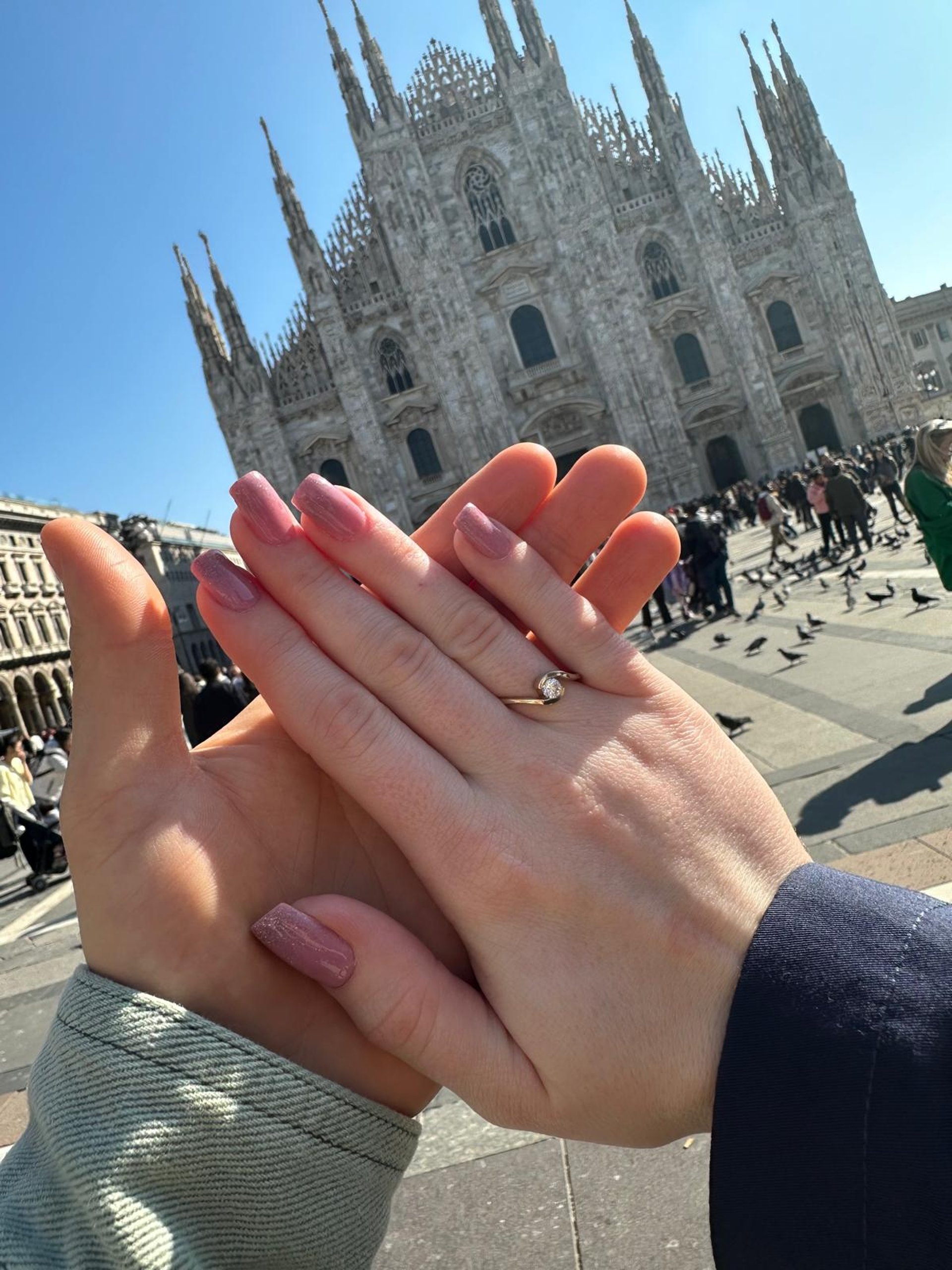 couple wearing silver-colored rings