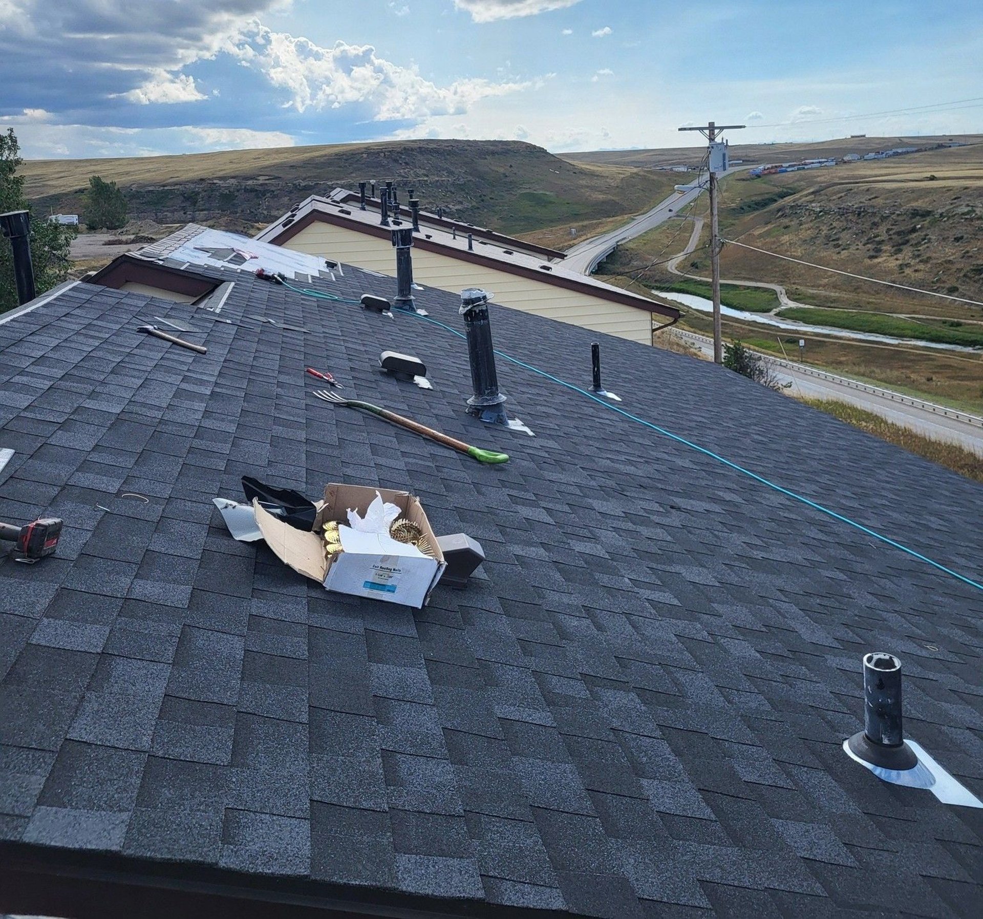an abstract photo of a curved building with a blue sky in the background