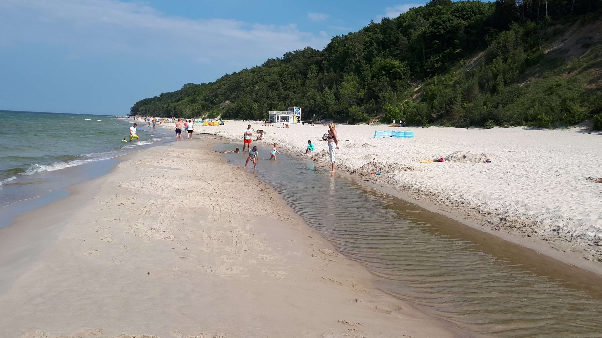 woman wearing yellow long-sleeved dress under white clouds and blue sky during daytime