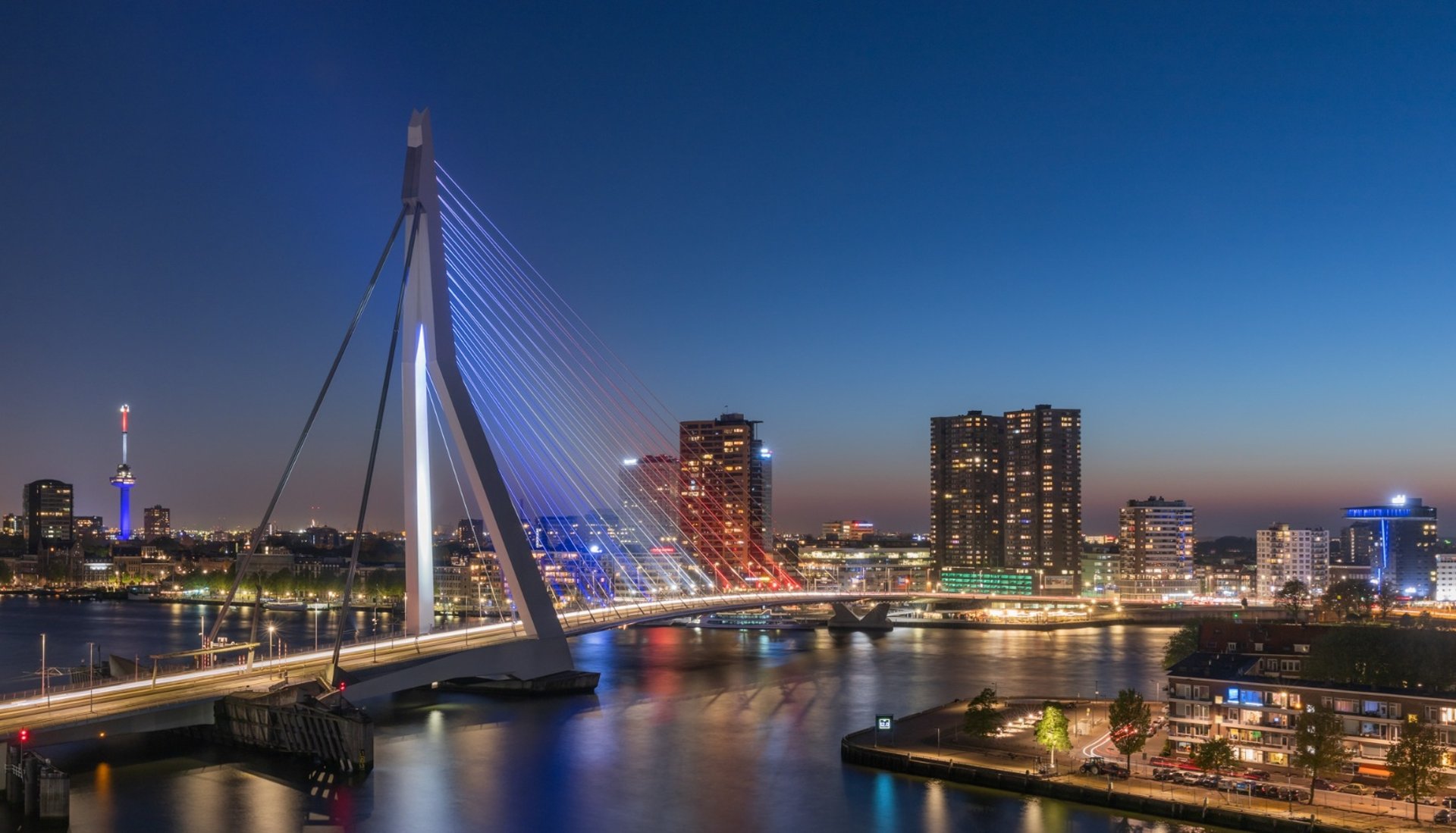 an abstract photo of a curved building with a blue sky in the background