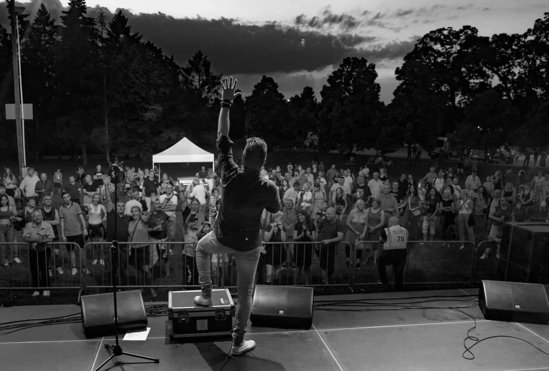 grayscale photo of band performing on stage