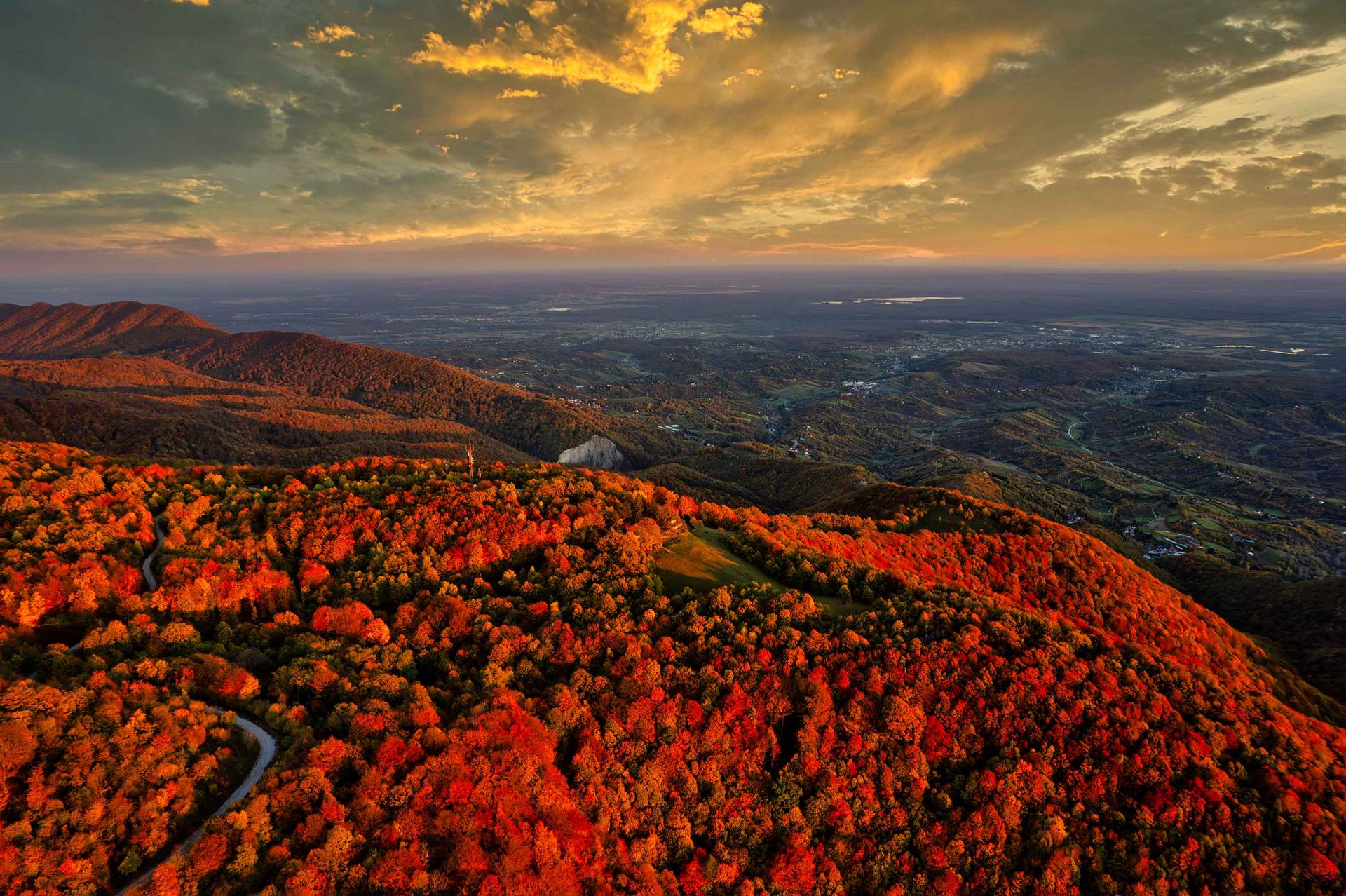 an abstract photo of a curved building with a blue sky in the background