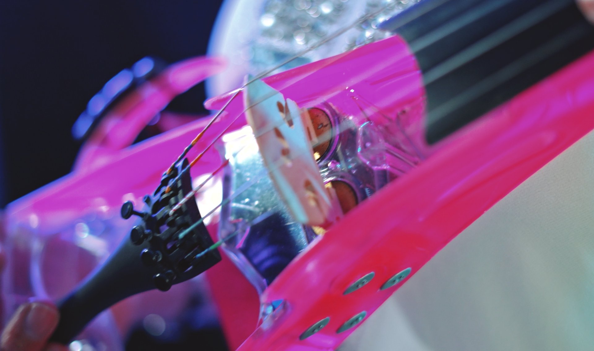 an abstract photo of a curved building with a blue sky in the background