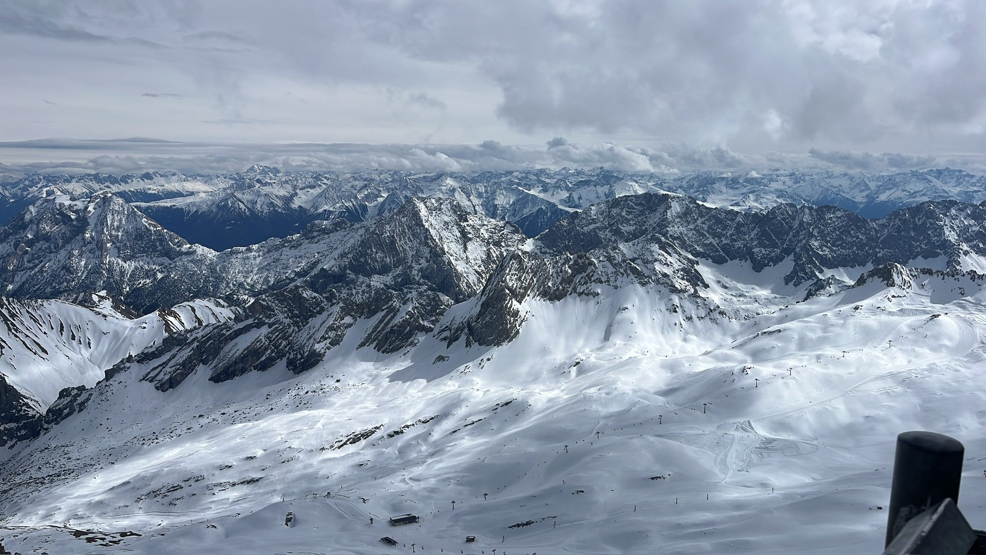 an abstract photo of a curved building with a blue sky in the background