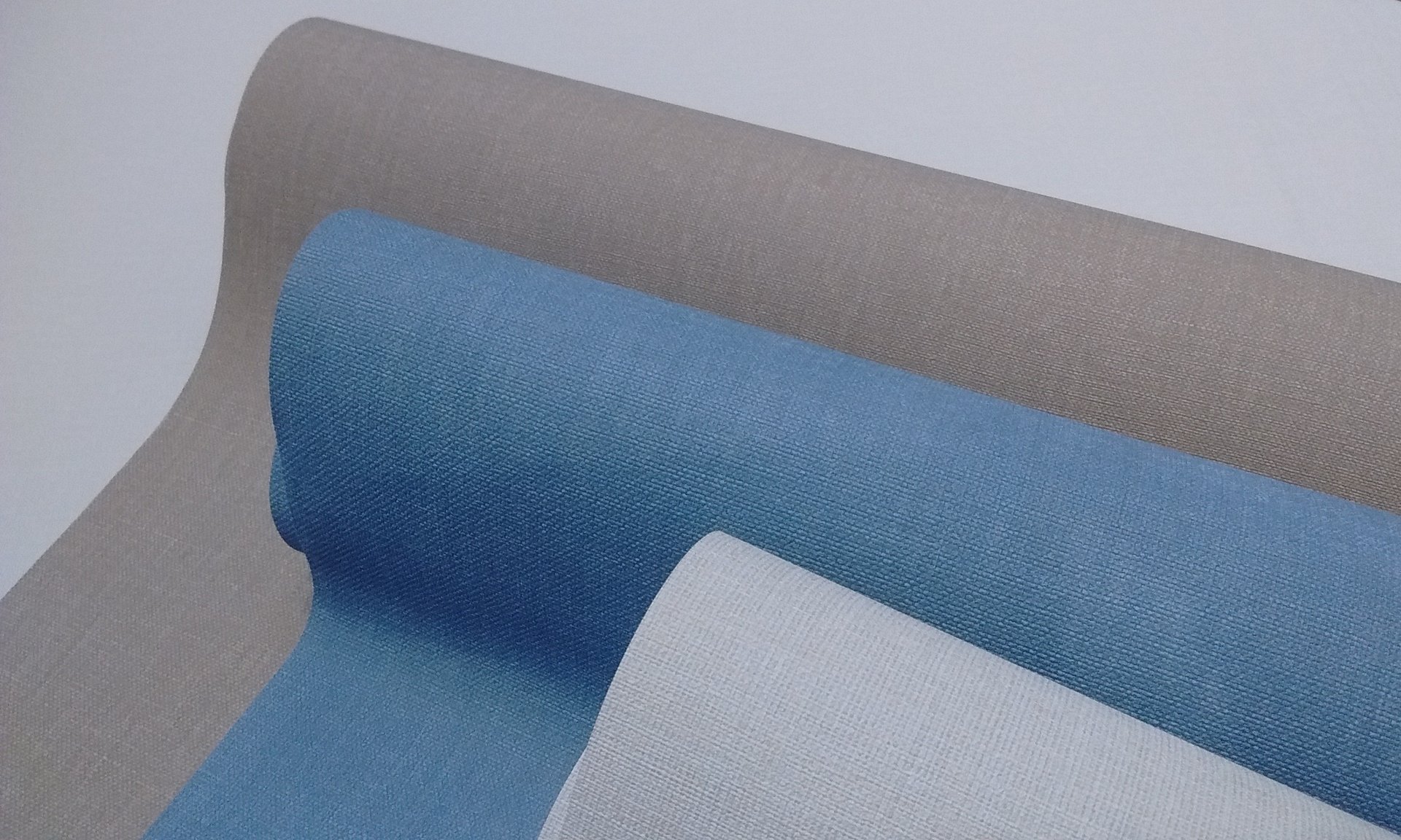 an abstract photo of a curved building with a blue sky in the background