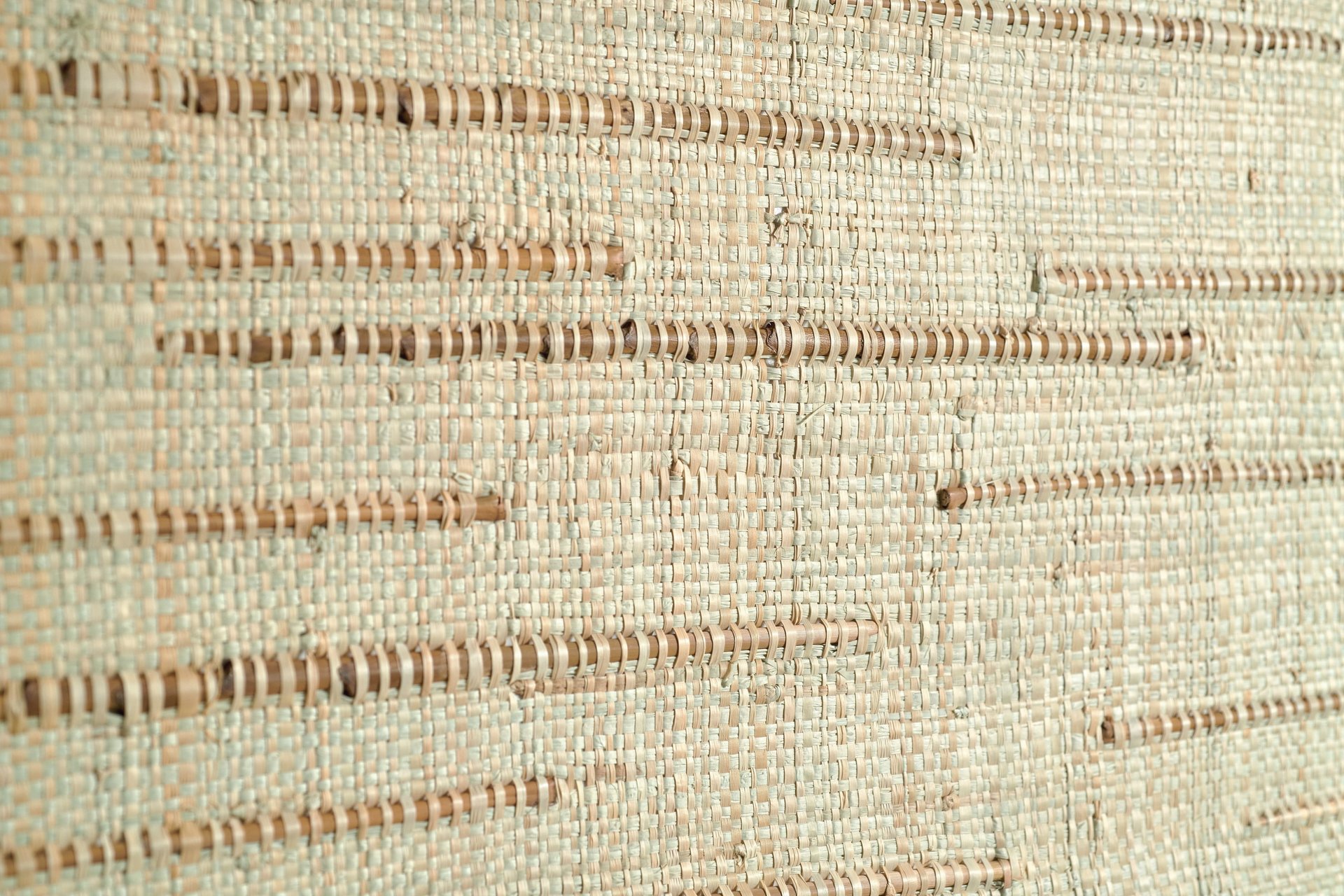 an abstract photo of a curved building with a blue sky in the background