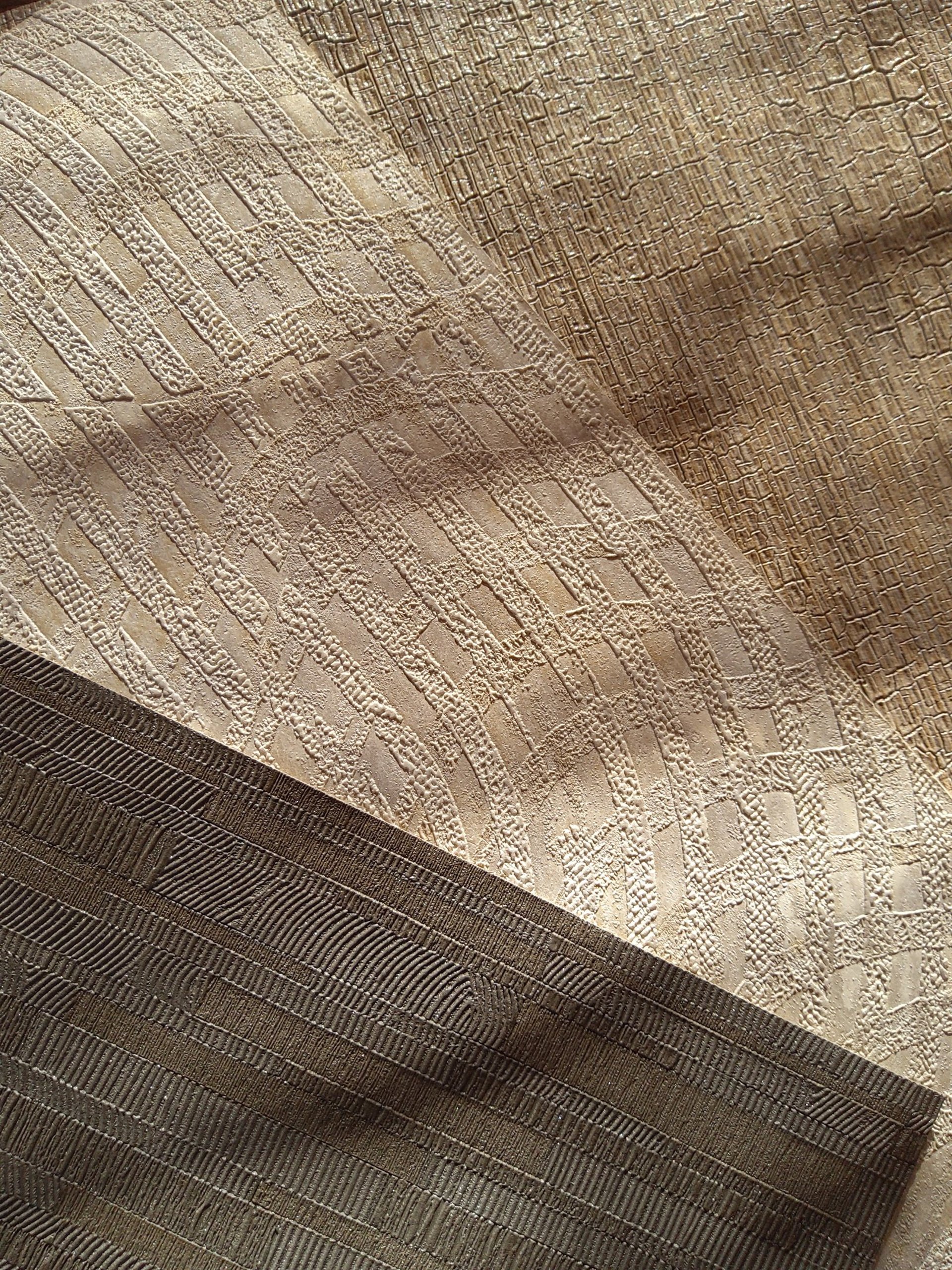 an abstract photo of a curved building with a blue sky in the background