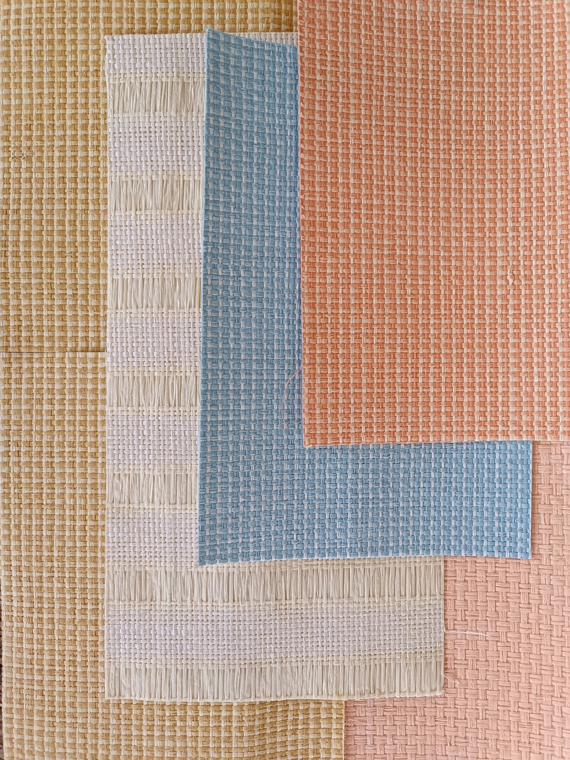 an abstract photo of a curved building with a blue sky in the background