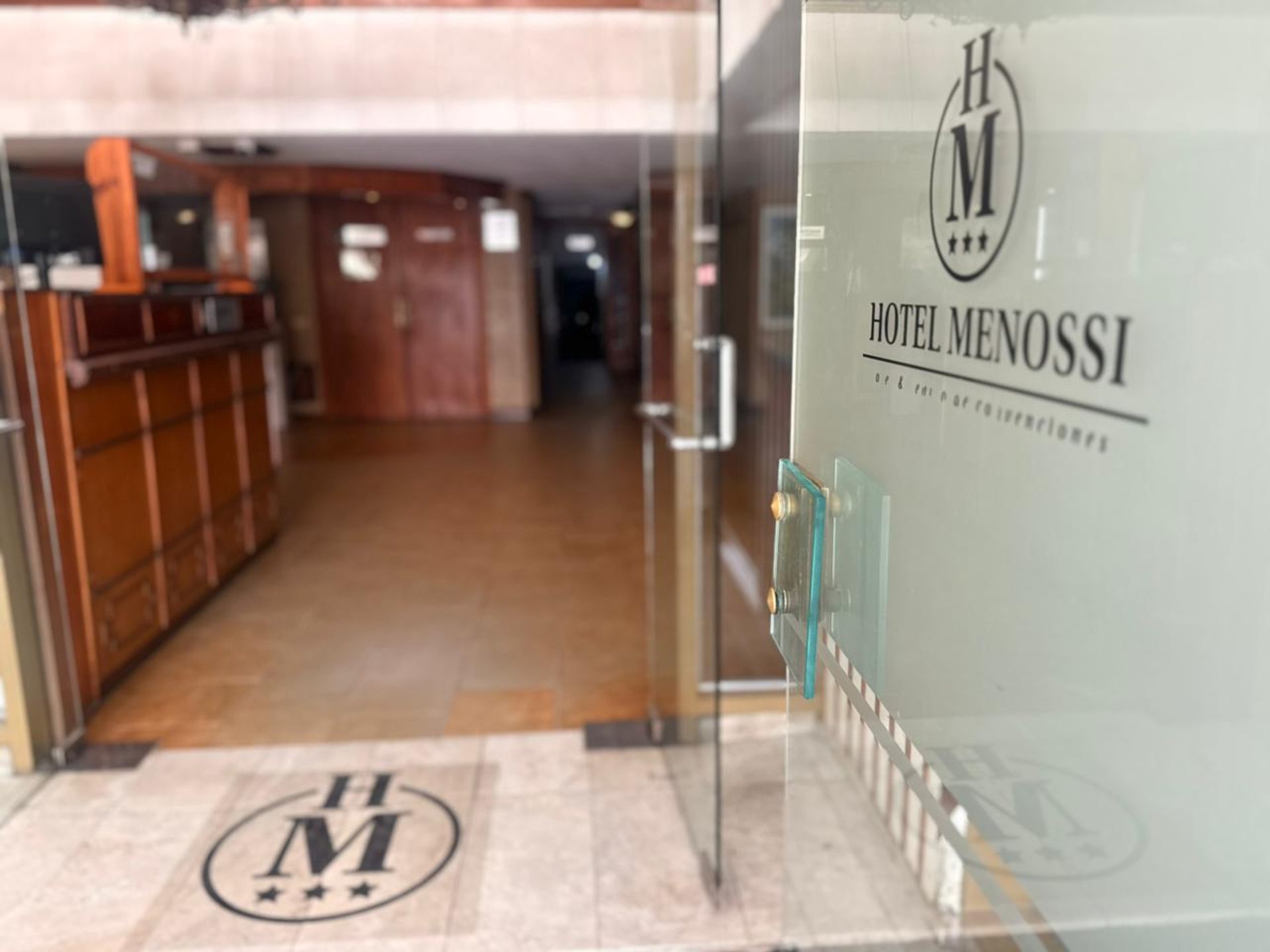 an abstract photo of a curved building with a blue sky in the background