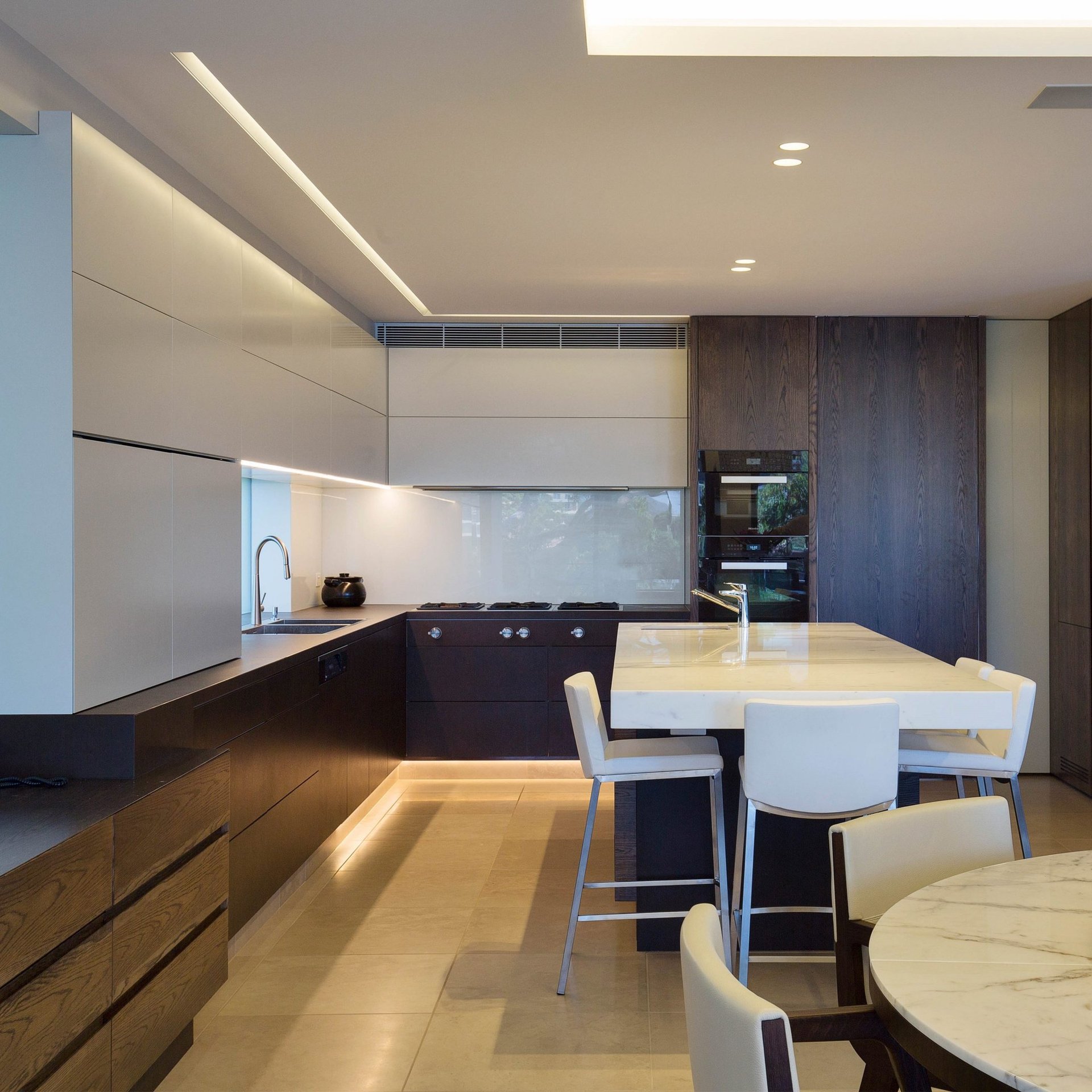 an abstract photo of a curved building with a blue sky in the background