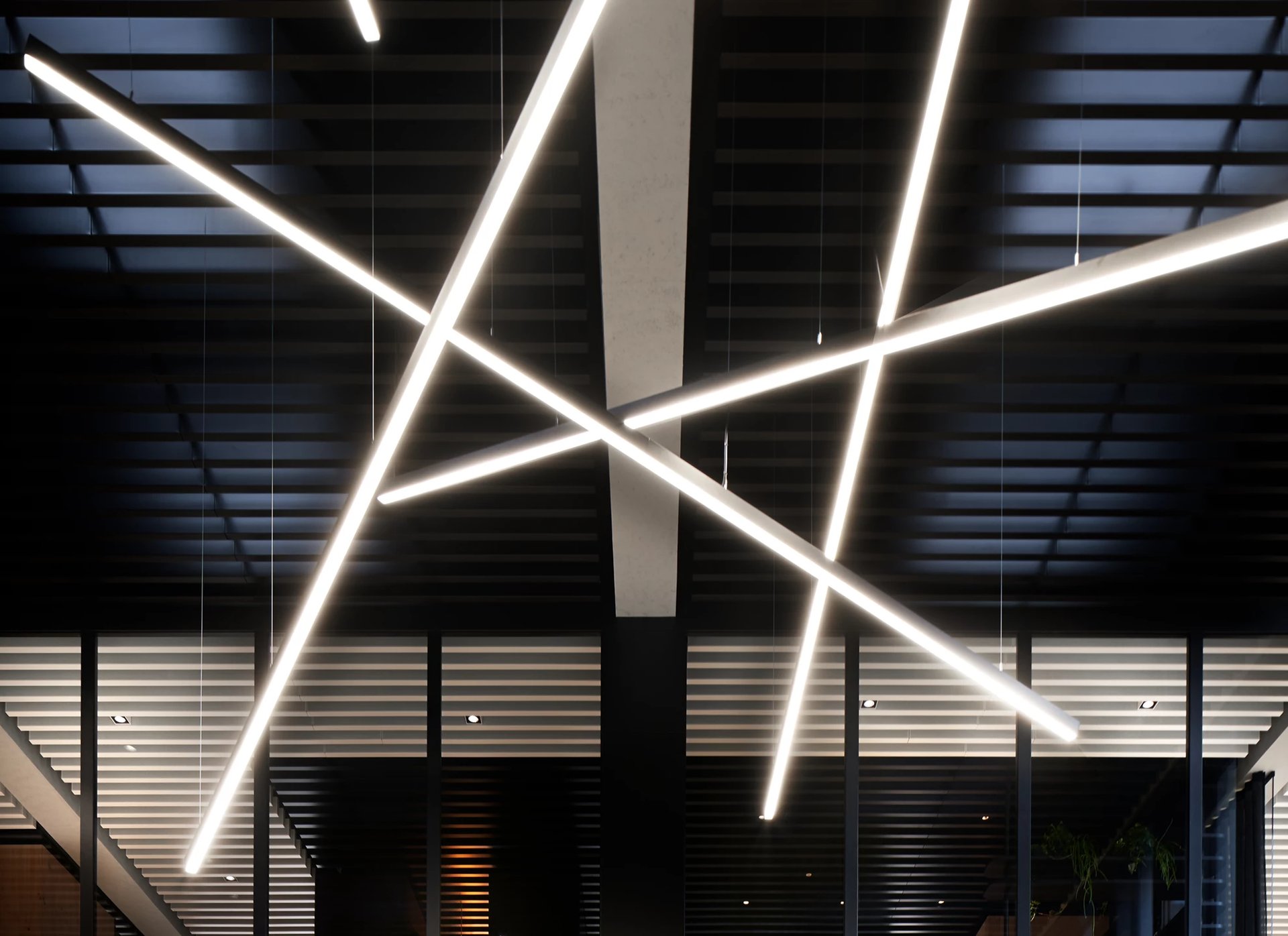 an abstract photo of a curved building with a blue sky in the background