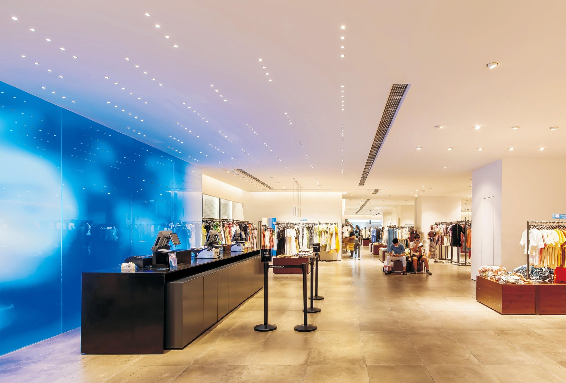an abstract photo of a curved building with a blue sky in the background