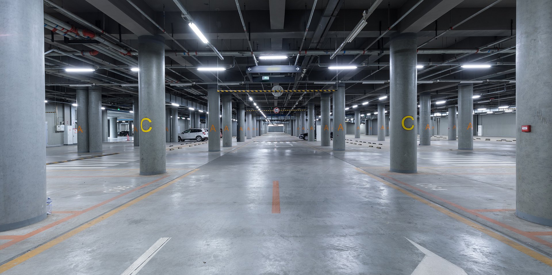 an abstract photo of a curved building with a blue sky in the background