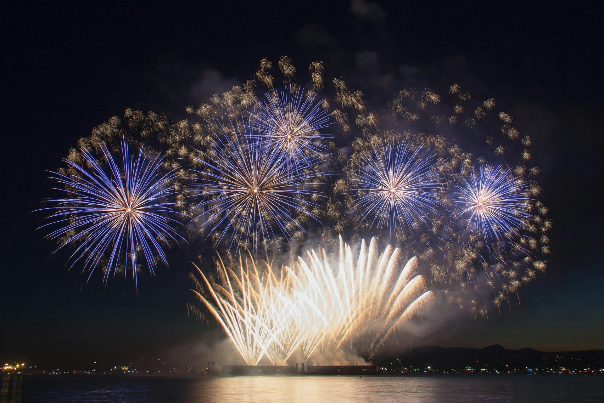 people standing in gold and white floral ceiling