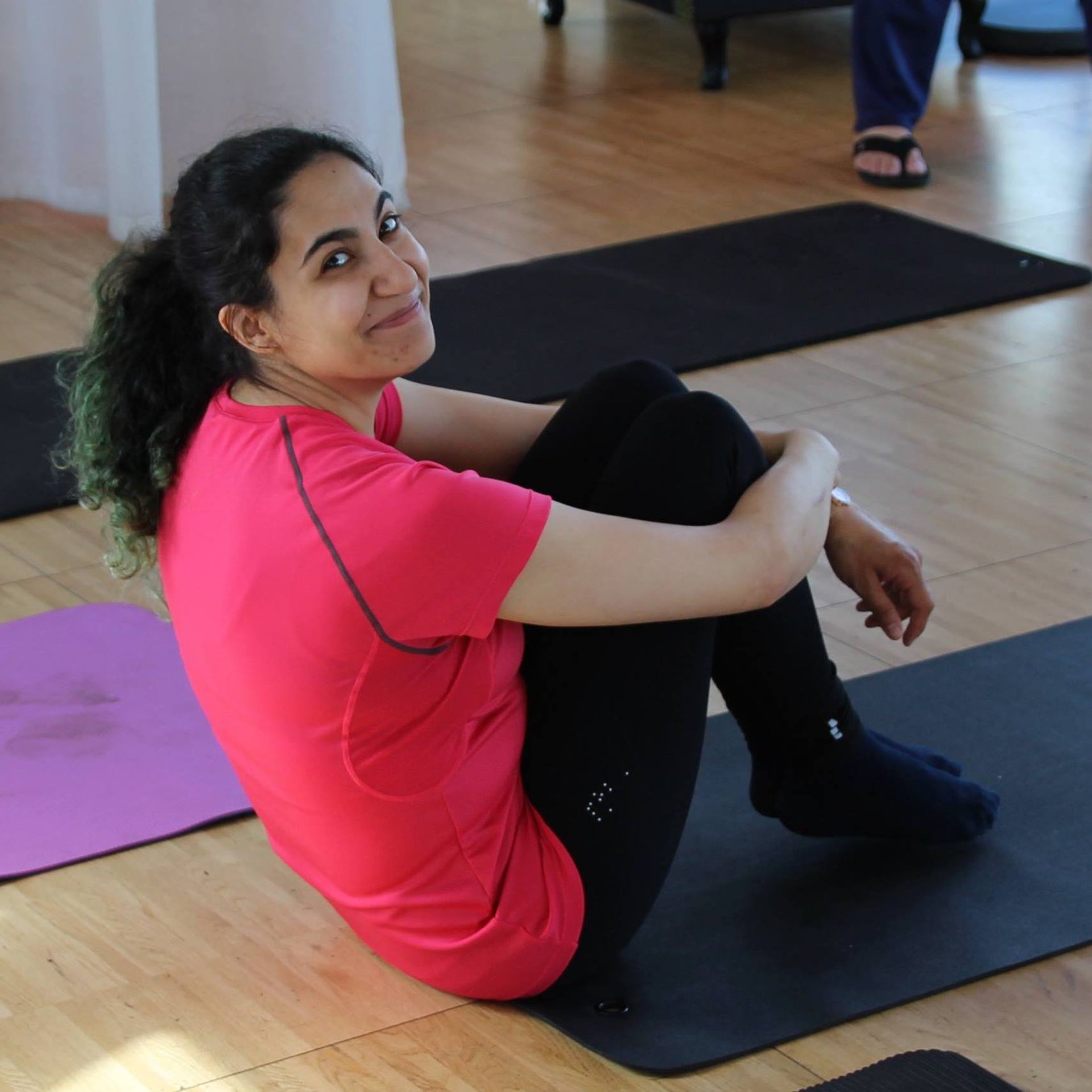 a group of people doing exercises in a gym