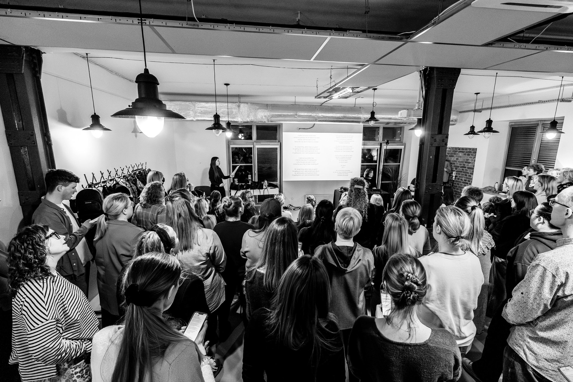 an abstract photo of a curved building with a blue sky in the background