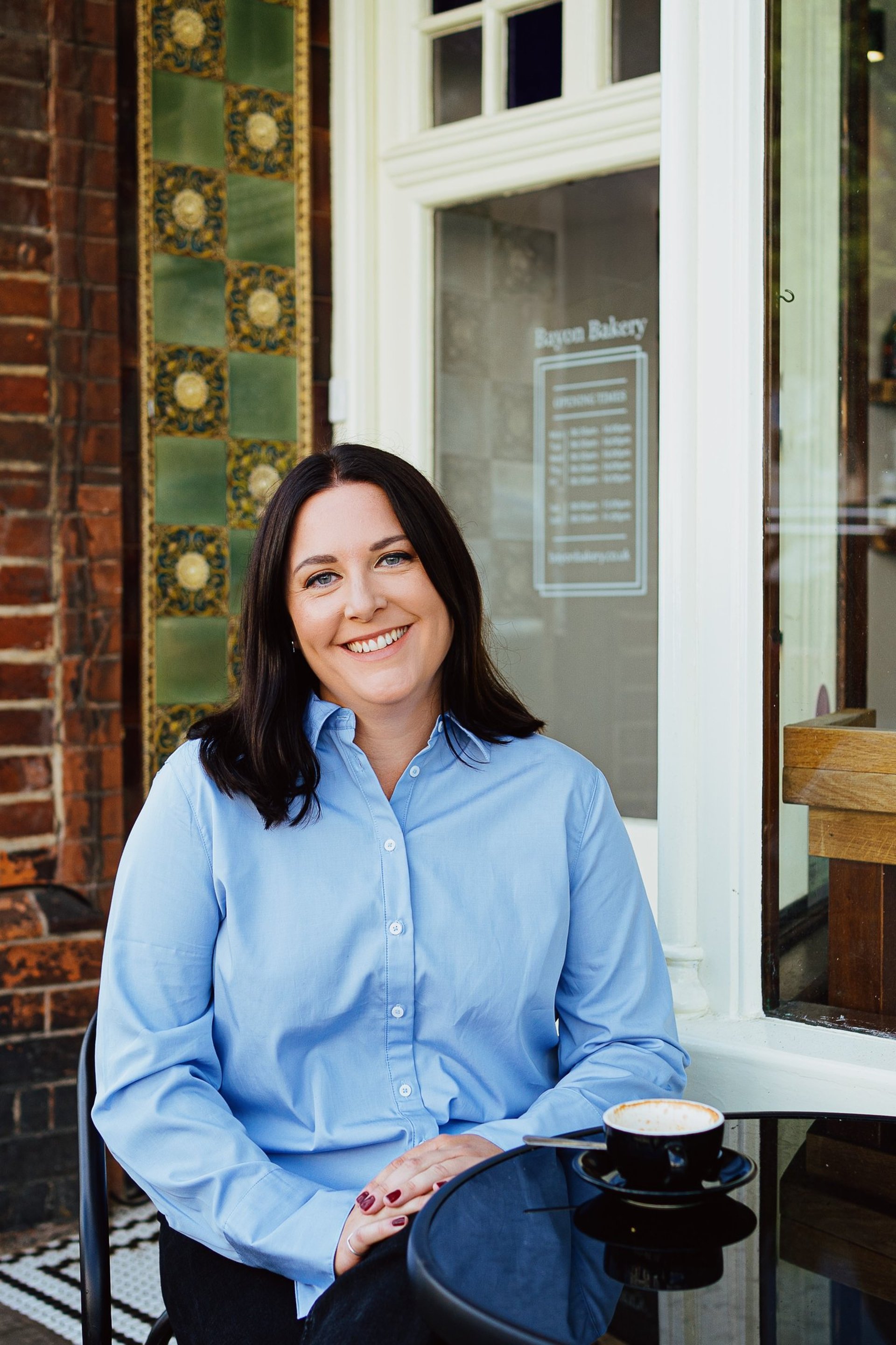 an abstract photo of a curved building with a blue sky in the background