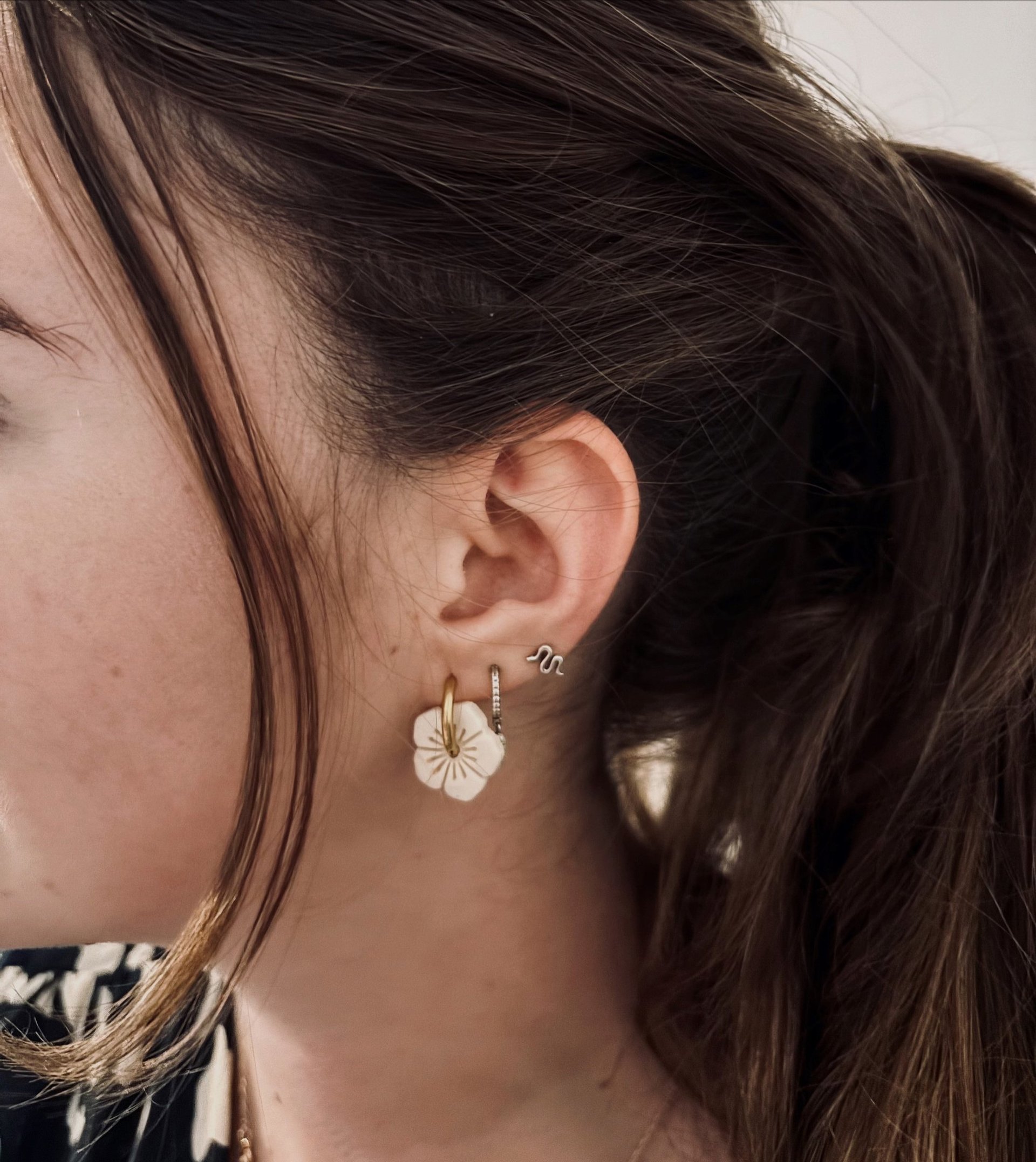 woman holding dried flower