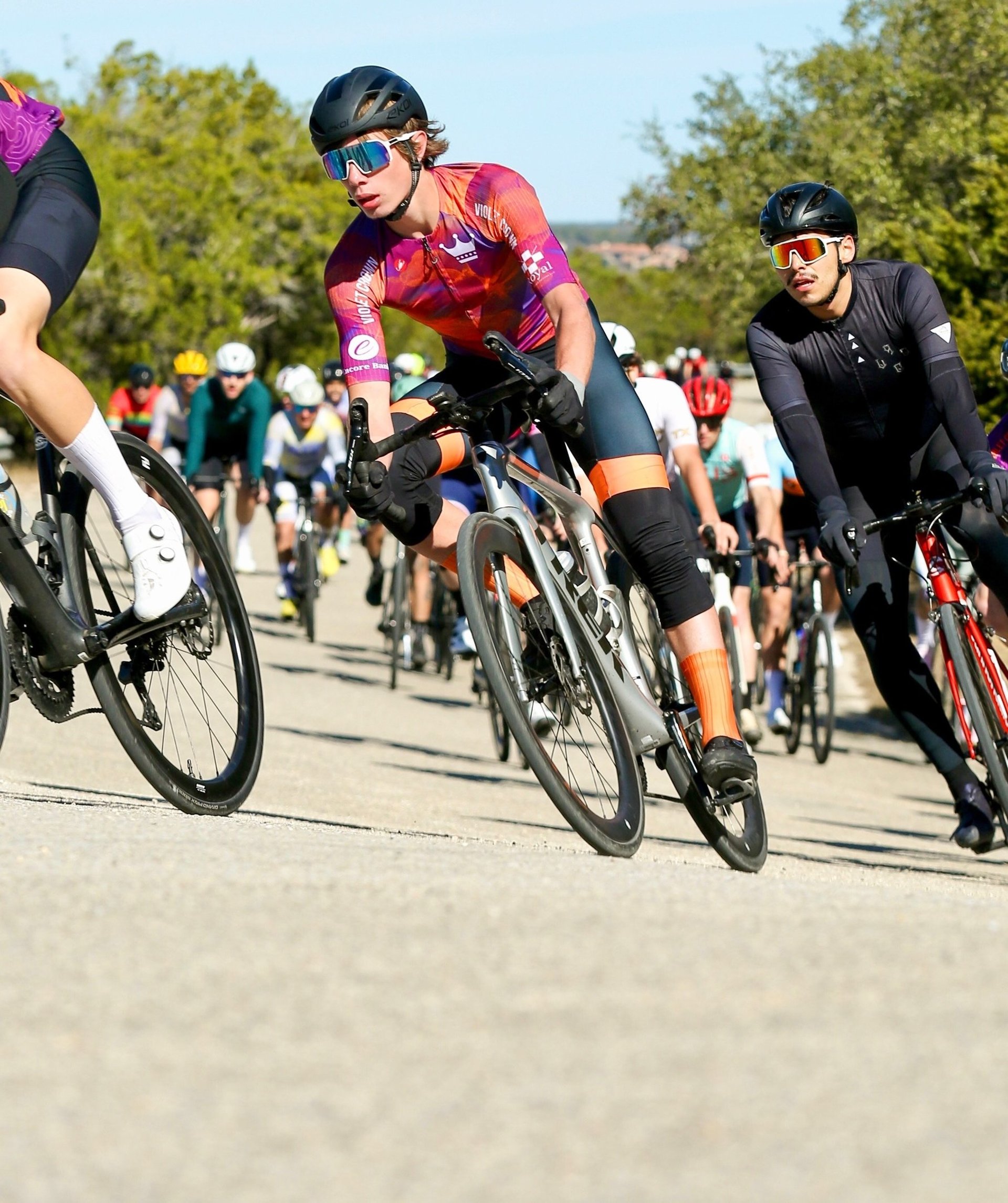 man cornering n road bike race