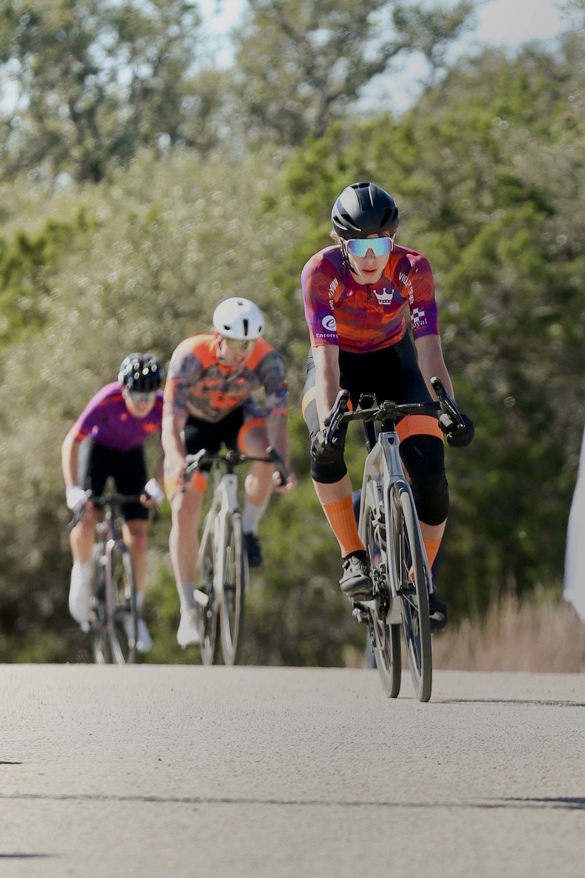 person mountain biking down steep hill