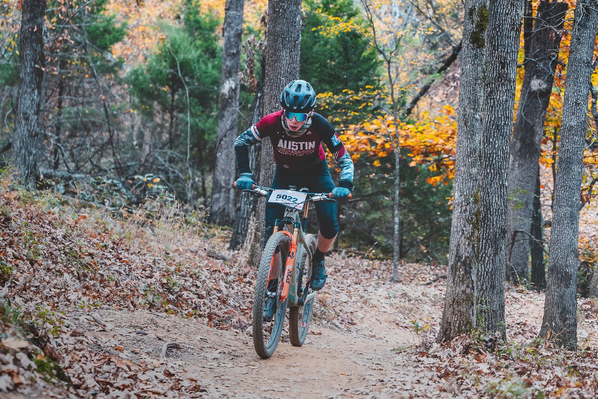 man biking in forest