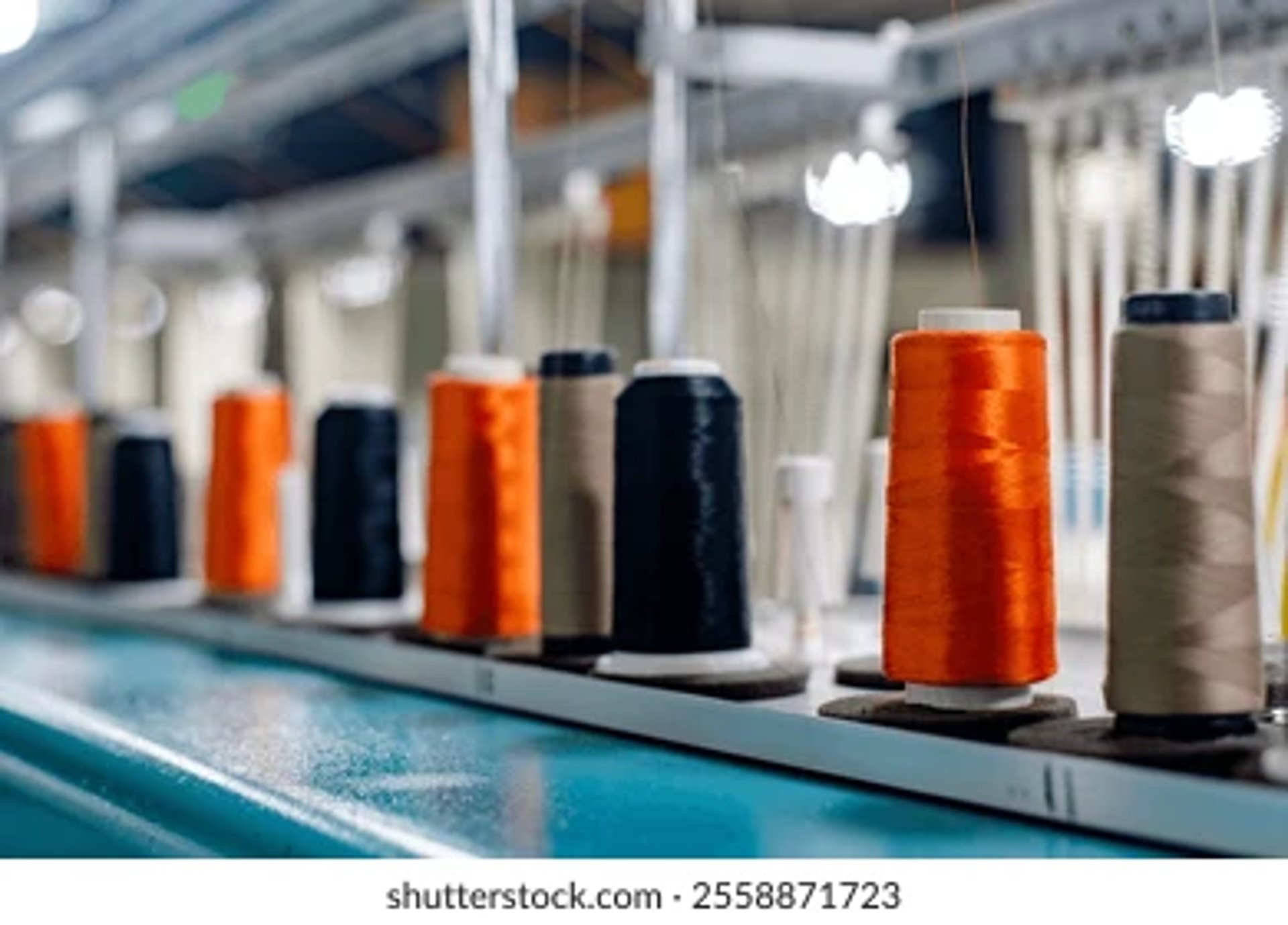an abstract photo of a curved building with a blue sky in the background