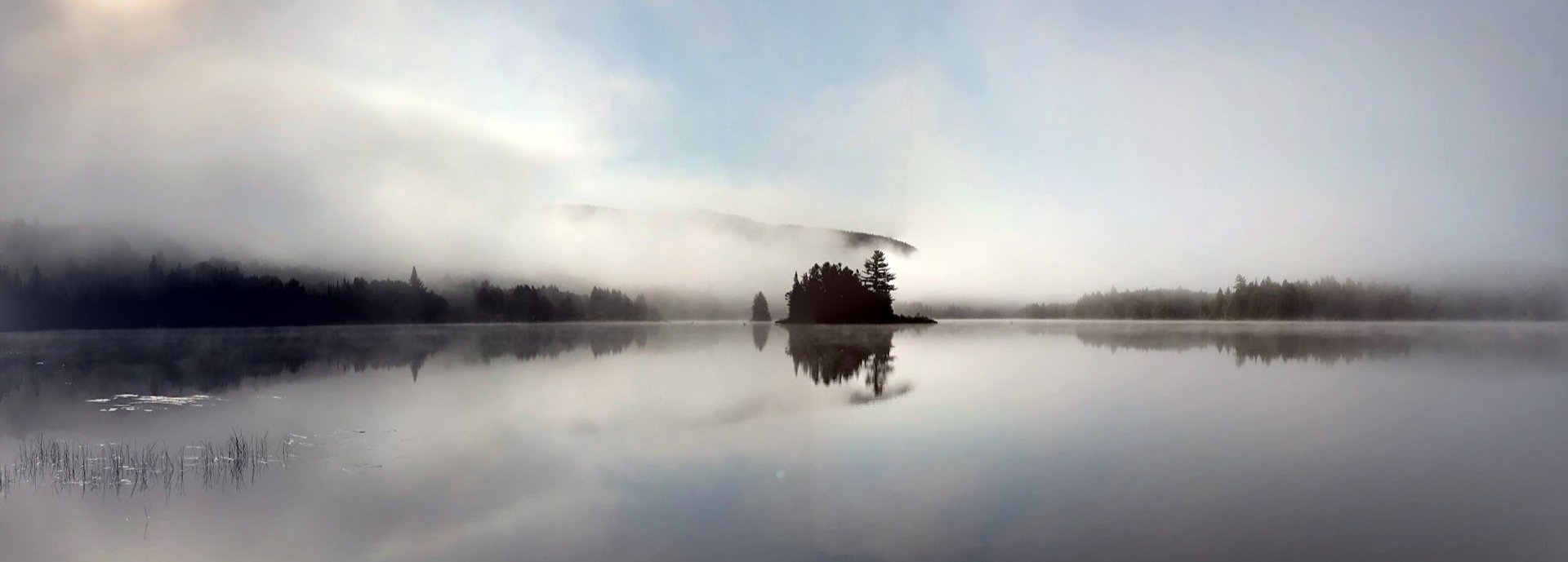 an abstract photo of a curved building with a blue sky in the background